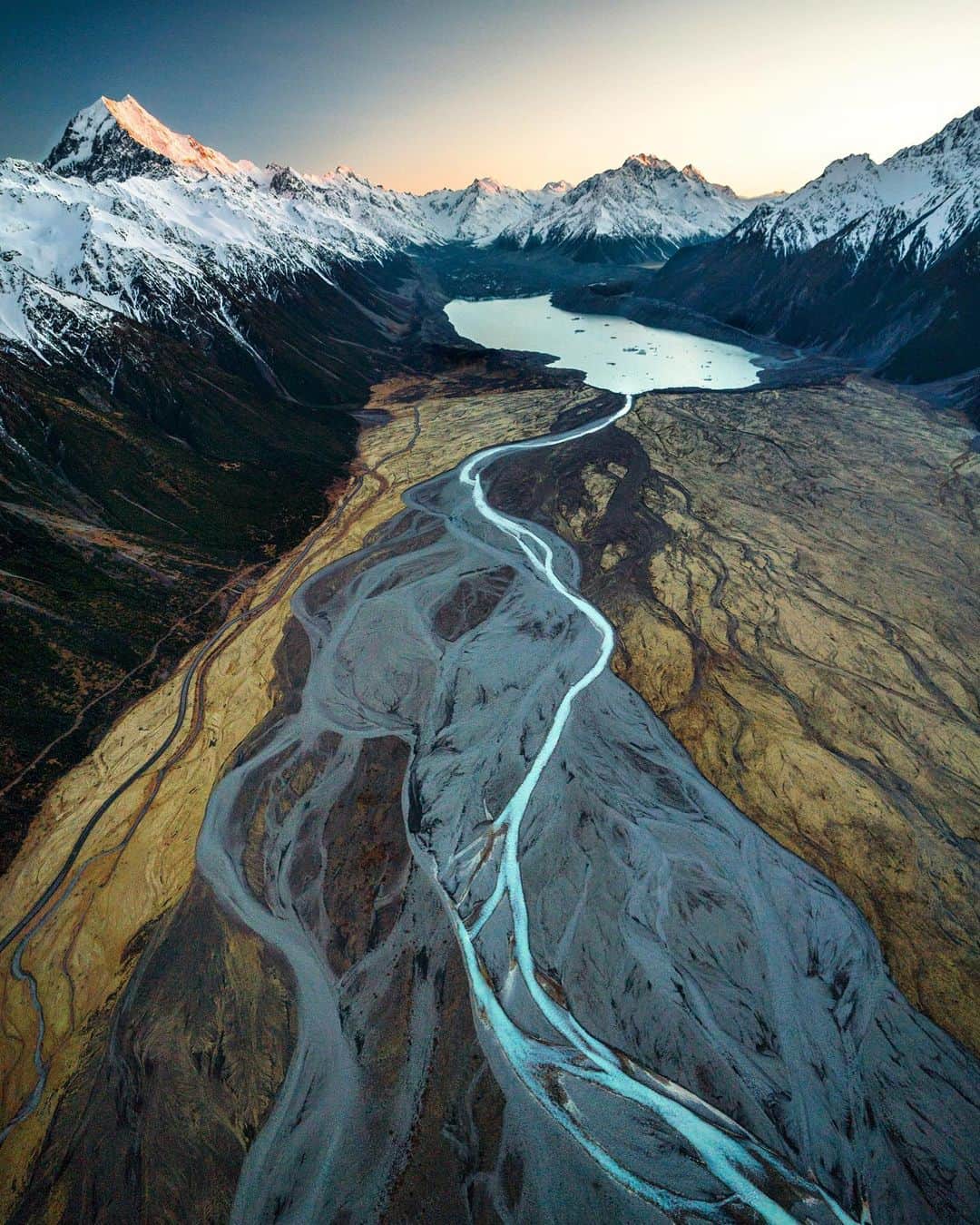 クリス・バーカードのインスタグラム：「“Take a single photograph that represented humans relationship with nature.” That was the brief I got from @icebreakernz . The assignment will go down as one my all times favorites for it’s challenges & rewards. We went to the epic Tasman Lake, New Zealand in the Mount Cook National Park. It was crazy to learn that this beautiful lake was incredibly new, only 40 years old. It was the literal open wound of a melting glacier. To see the full film behind the image check my IGTV or bio link. Thanks to the amazing team that brought this to life.」