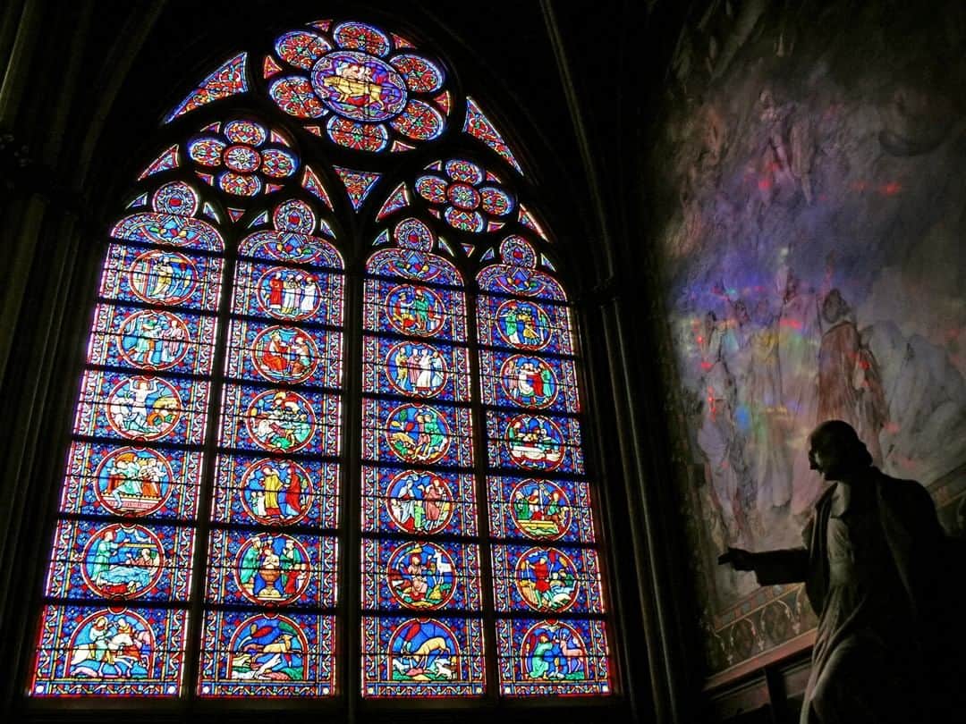 National Geographic Travelさんのインスタグラム写真 - (National Geographic TravelInstagram)「Photo by @babaktafreshi | A 13th-century stained-glass window, statue, and mural in one of the many elegantly designed spaces in Paris’s Notre Dame, before the fire. The cathedral survived wars and desecration during the French Revolution in the 1790s but suffered significant damage in April 2019. #notredame #paris」3月19日 1時07分 - natgeotravel