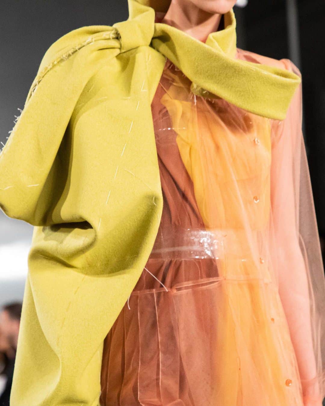 Maison Margielaさんのインスタグラム写真 - (Maison MargielaInstagram)「#MaisonMargiela ‘Défilé’ Co-ed AW20 Collection designed by @JGalliano Look 2 Peach tulle long-sleeved pleated dress worn over a nougat crêpe de chine and yellow chiffon strap dress, with a detachable pistachio felt asymmetric bow sleeve. White painted Tabi Mary-Janes and a Recicla teal leather 5AC bag.」2月26日 23時02分 - maisonmargiela