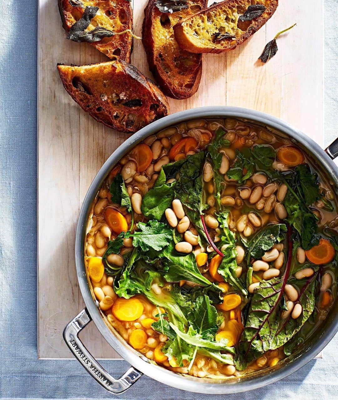 マーサ・スチュワートさんのインスタグラム写真 - (マーサ・スチュワートInstagram)「This one-pot, #meatlessmonday stew is warm, savory, and comforting. Made with cannellini beans, baby greens such as kale and spinach, carrots, and plenty of herbs and spice, serve it with toasted ciabatta bread rubbed with garlic to sop up every last bit of golden broth. Get the full recipe at the link in bio. 👆🏼📷: @juliagartland」3月3日 6時55分 - marthastewart