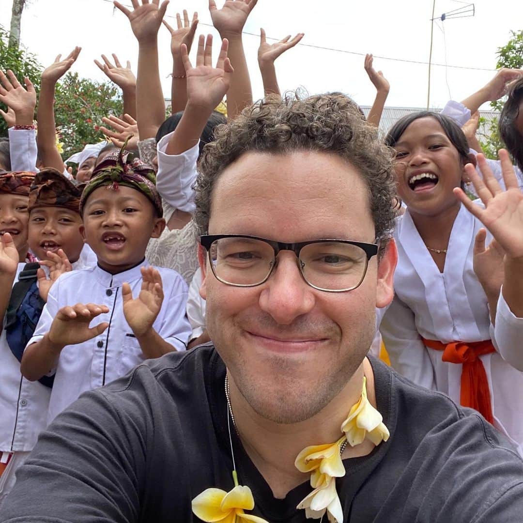 ティモシー・サイクスのインスタグラム：「Throwback to last week when we at @karmagawa opened 2 new schools in Bali, our 68th and 69th school worldwide, in  honor of 2 great friends @adamw and @amirzakeri and we also unveiled our first school bus because too many kids here are forced to walk 1-4 hours per day on dangerously narrow roads to get to and from school and if it rains, for safety’s sake, they just don’t go. Now, this minibus will transport dozens of kids per day and we’re just getting started…because I was also proud to announce another $70,000 donation to @balichildrensproject for more new schools and more minibuses in the future! People ask why I post about my #charitywork publicly and not only is it because I show EVERYTHING that’s happening in my life (it’s good to be real in my industry full of scams), I’m also excited to report that aside from the 69 schools we’ve now built, our social media followers have also donated a lot to @balichildrensproject so much so that they’ve now built another 25 schools all thanks to everyone’s donations! How cool is that? Remember Karmagawa got involved, they had never built ANY schools, they just gave books and toy donations (which they still do and are also useful)! So, thank you everyone for your donations, please keep sharing our posts and let’s get the word out to raise even more money to help more kids out as every child deserves the chance at a proper education! #newschool #givingisliving #karmagawa #jewsinthejungle」