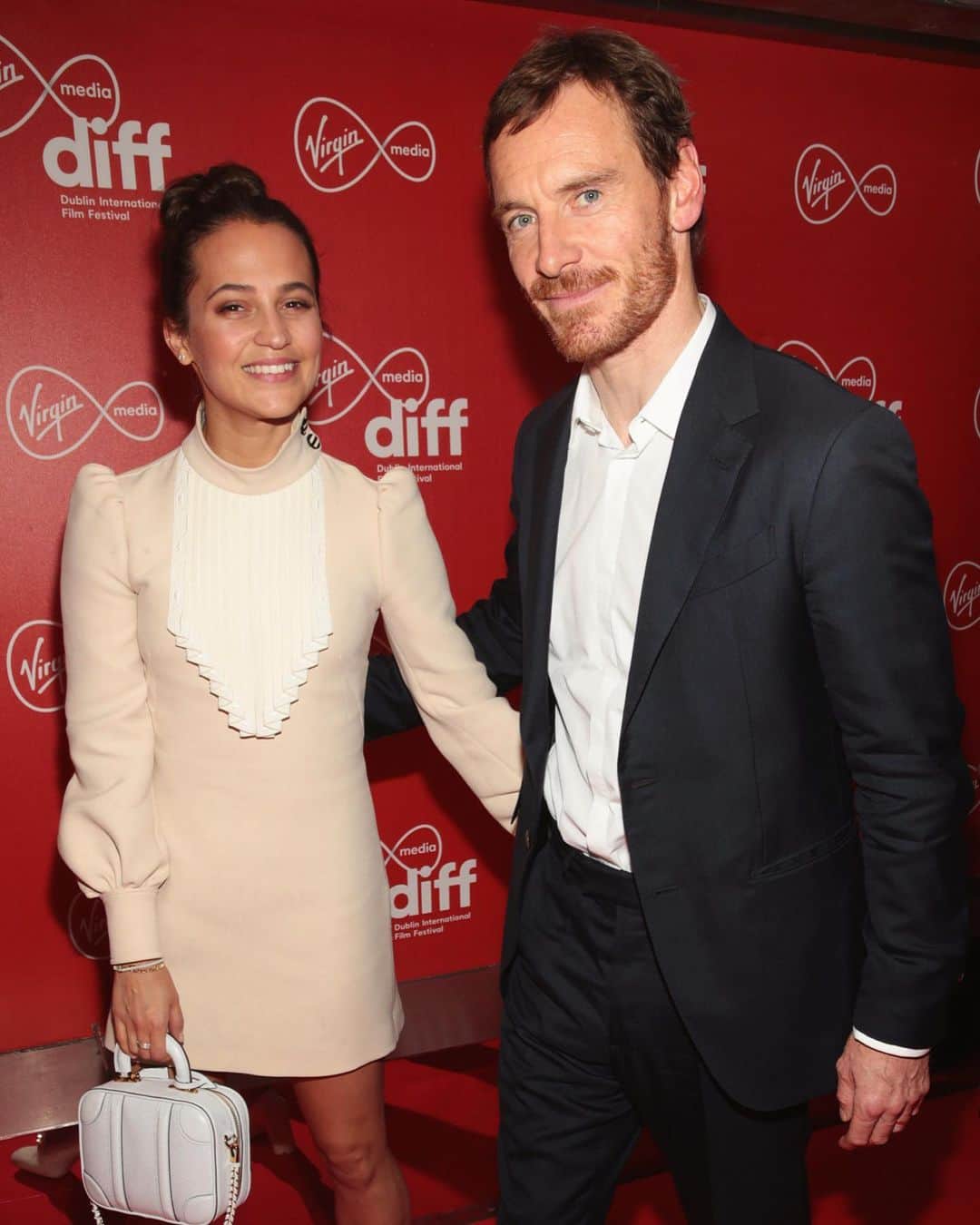 アリシア・ヴィキャンデルのインスタグラム：「Alicia and her husband Michael Fassbender arriving to last night’s Calm With Horses screening at Dublin International Film Festival.」