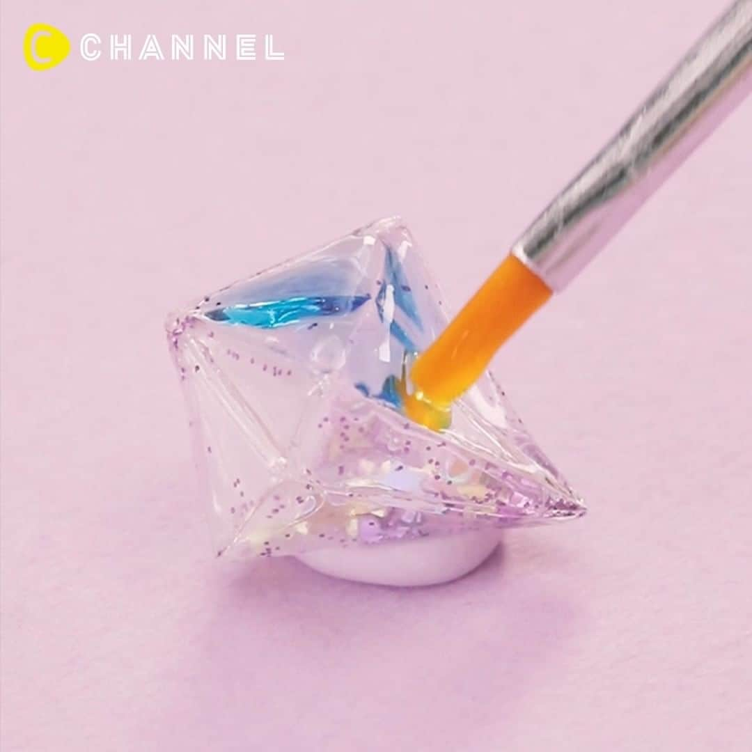 C CHANNEL-Art&Studyのインスタグラム：「Clear Diamond Origami Earrings ✨ 揺れる♡スケルトン折紙ピアス✨ . 🎨Follow me👉 @cchannel_artandstudy 🎵 💡Check👉 @cchannel_girls 🎶 📲C CHANNELのアプリもよろしくお願いします💕 . 【Materials】 ・ Transparent cellophane (5 × 5㎝) ・ Glitter, hologram ・ Resin (KIYOHARA) ・ Resin colorant ・ UV light ・needle ・ Round Pincers ・ Flat Pincers ・ Heaton ・ Round can ・ Piercing parts . . [Steps] 1. Fold cellophane into a diamond shape as you would with origami. 2. Open a part, put in the glitter and hologram, and fold as before. 3. Inflate cellophane. 4. Apply resin to the entire surface. 5. Coat the colored resin with blue, yellow and orange in order to make a gradient. 6. Make a hole at the top with a needle and glue Heaton with a small amount of resin. 7. Attach the piercing bracket and complete. . . 揺れるたびにキラキラ輝く♡クリアセロハンを使った折紙ピアスのご紹介です！ . ＜用意するもの＞ ・透明セロハン（5×5㎝） ・ラメ、ホログラム ・KIYOHARA LED & UVクラフトレジン液 ・レジン着色剤 ・UVライト ・針 ・丸ヤットコ ・平ヤットコ ・ヒートン ・丸カン ・ピアスパーツ . ＜作り方＞ 1.セロハンをダイヤ型に折る。 2.一部を開いてラメとホログラムを入れ、元の通りに折る。 3.セロハンを膨らませる。 4.全面にレジンを塗り、UVライトで約 10 秒硬化する。 5.着色したレジンを青、黄色、オレンジの順でグラデーションになるようにコーティングする。 6.頂点に針で穴を開け、レジンを少量付けたヒートンを接着する。 7.ピアス金具を取り付けて完成。 . ※作業中は手袋の使用、部屋の換気をおすすめします。 ※レジンは高温となりますので取り扱いには十分に注意してください。 . #DIY#doityourself#diyideas#crafts#crafting#instacraft#crafter#crafty#handmade#handcrafted#handmadecrafts#handmadeaccessories#ideas#resin#resinart#resina#Fantastic#incredible#creative#heart#howto#tutorial#tips #origami#paperart#origamiart#crane#hologram#japaneseculture#earrings」