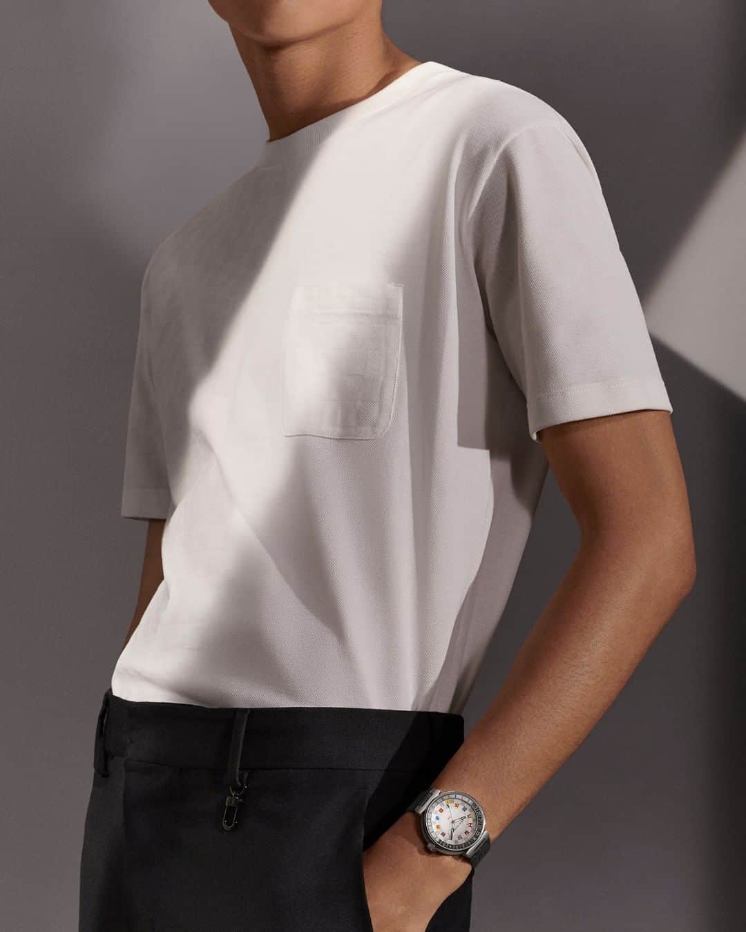 のインスタグラム：「Dynamic design. #LouisVuitton’s signature flags serve as time markers on a new Tambour Moon Dual Time watch. Explore the latest collection of timepieces for both men and women via link in bio.」