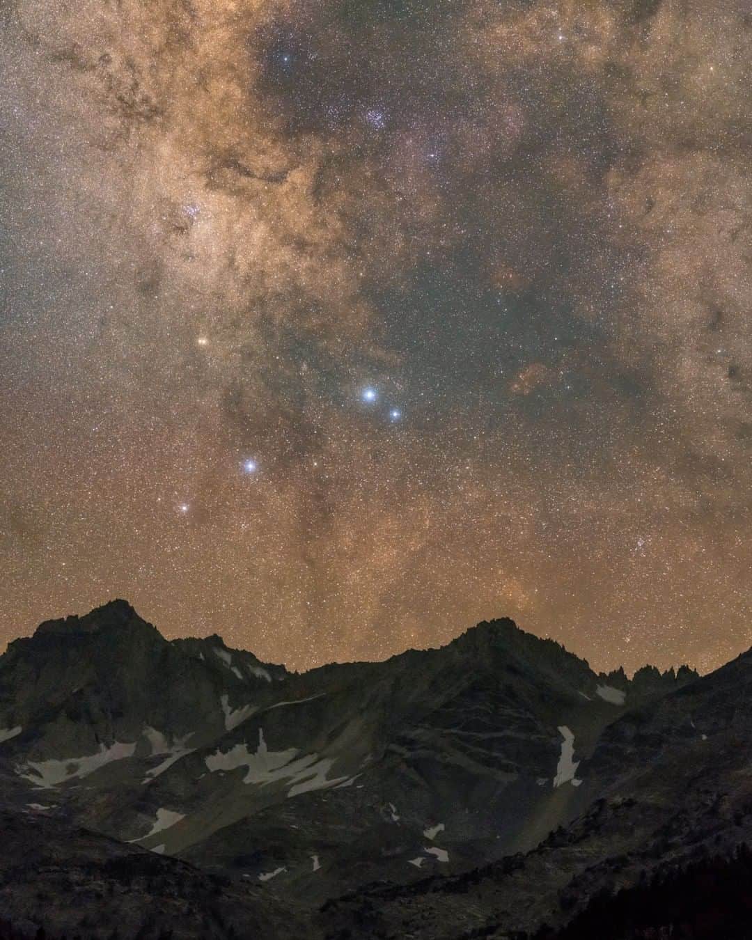 National Geographic Travelさんのインスタグラム写真 - (National Geographic TravelInstagram)「Photo by @babaktafreshi | From Earth to the universe. Far from light pollution and under a star-filled sky, the rugged peaks of California’s Sierra Nevada appear in this single-exposure close-up photograph of the Milky Way, made using a fast lens and a sensitive digital camera. We are looking at the tail of the celestial scorpion, marked by the two stars in the center.  Explore more of the World at Night with me @babaktafreshi. #saveournightsky #astrophotography #milkyway #astronomy」3月16日 17時08分 - natgeotravel