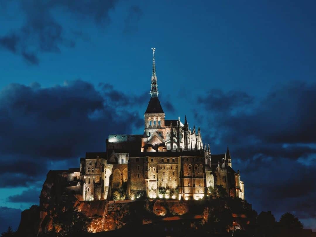 National Geographic Travelさんのインスタグラム写真 - (National Geographic TravelInstagram)「Photo by @paoloverzone | The history of the magnificent Mont-Saint-Michel in Normandy, France, dates back to 708 when Aubert, Bishop of Avranches, built the sanctuary dedicated to the archangel Michael. It became a center for learning and pilgrims have visited the site for centuries. The island is a perfect example of efficient military architecture; its fortifications resisted all the English assaults. Today visitors can enjoy the abbey in all its splendor. Follow @paoloverzone for more photos and stories. #normandy #montsaintmichel」4月20日 21時07分 - natgeotravel