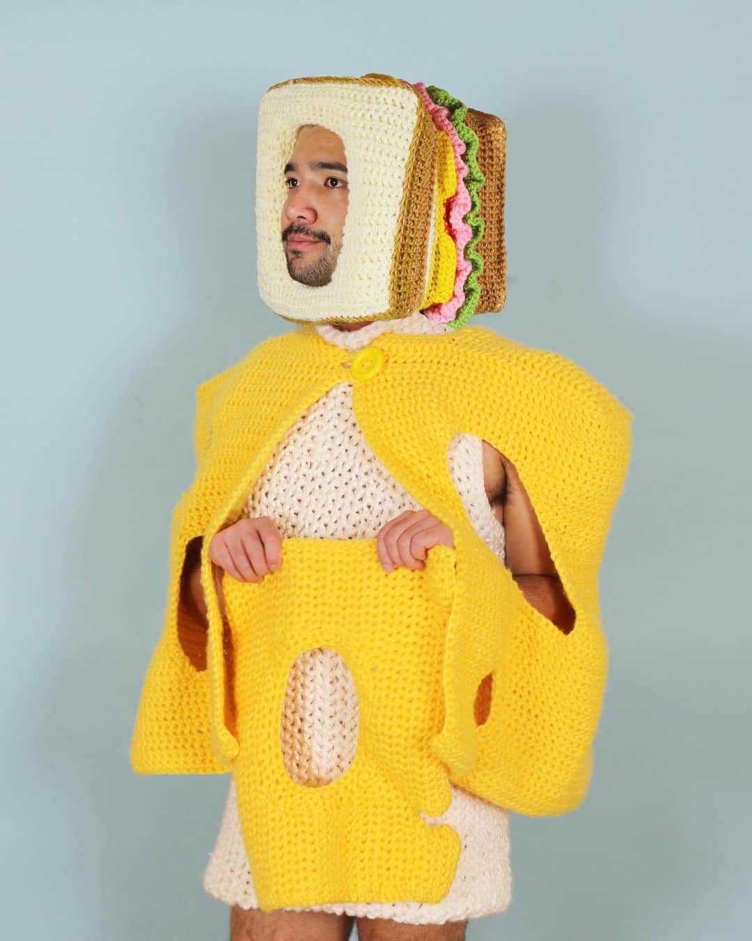 Phil Fergusonのインスタグラム：「Just thinking about a sandwich (myself). If there was a hat that’s go with this cheese outfit, what would I make? Comment below.  #sandwich #cheese #crochet #knit #craft #wearableart #fashion #art #queerart #capes #hats #cats #splats」