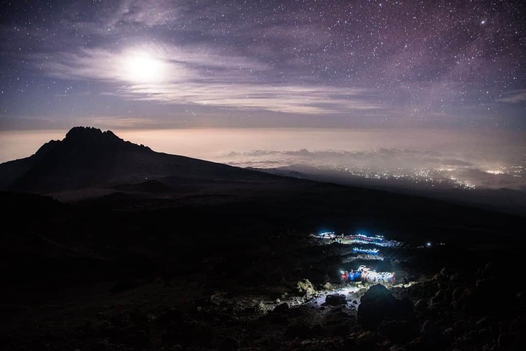 National Geographic Travelさんのインスタグラム写真 - (National Geographic TravelInstagram)「Photo by @taylorglenn | Lights from climbers' headlamps reveal their positions during the summit push on Mount Kilimanjaro. The city of Arusha can be seen in the background. Follow @taylorglenn for more from Tanzania and beyond. #kilimanjaro #tanzania」4月26日 1時07分 - natgeotravel
