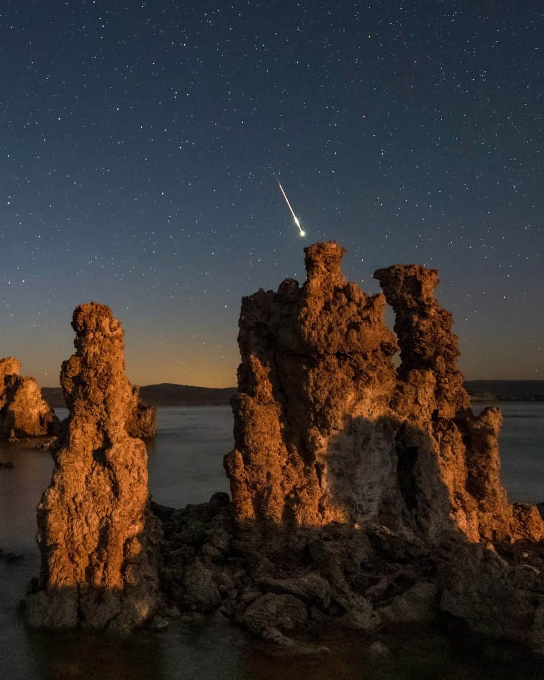 National Geographic Travelさんのインスタグラム写真 - (National Geographic TravelInstagram)「Photo by @babaktafreshi | On this June night, I was enjoying the moonrise from the otherworldly landscape of Mono Lake, California, when this beautiful meteor flashed in the starry sky. On any dark night, a consistent observer may see a meteor every 10 to 15 minutes on average, especially toward the morning. The rate is more frequent during meteor showers. The sporadic meteors like this are formed by wandering rocks or ice that enter the Earth’s atmosphere at very high speeds. ⁣ Explore the world at night with me @babaktafreshi. #twanight #saveournightsky #shootingstar #astrophotography」4月28日 9時05分 - natgeotravel