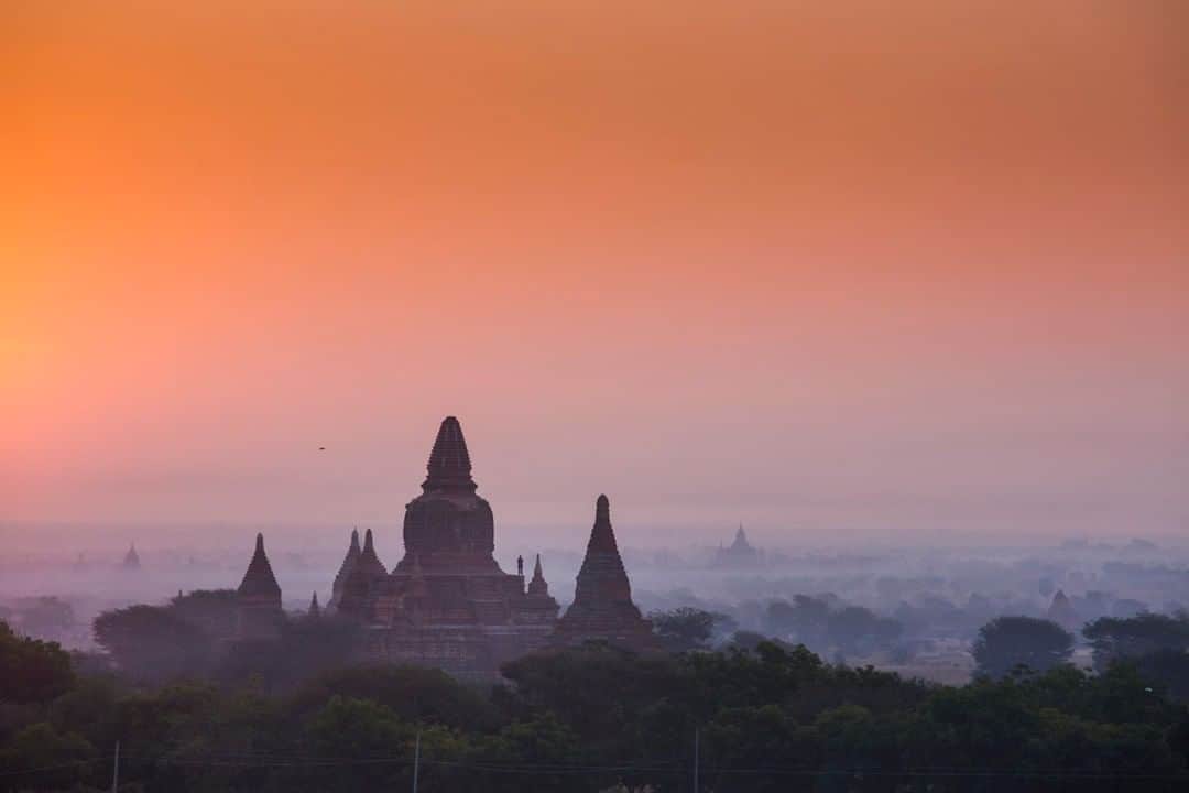 National Geographic Travelさんのインスタグラム写真 - (National Geographic TravelInstagram)「Photo by @emilypolar | An early riser takes in the view of the morning glow from one of the many temples in Bagan, Myanmar. To see more of Myanmar and beyond, follow me @emilypolar. #Myanmar #Bagan #Burma」4月28日 13時09分 - natgeotravel