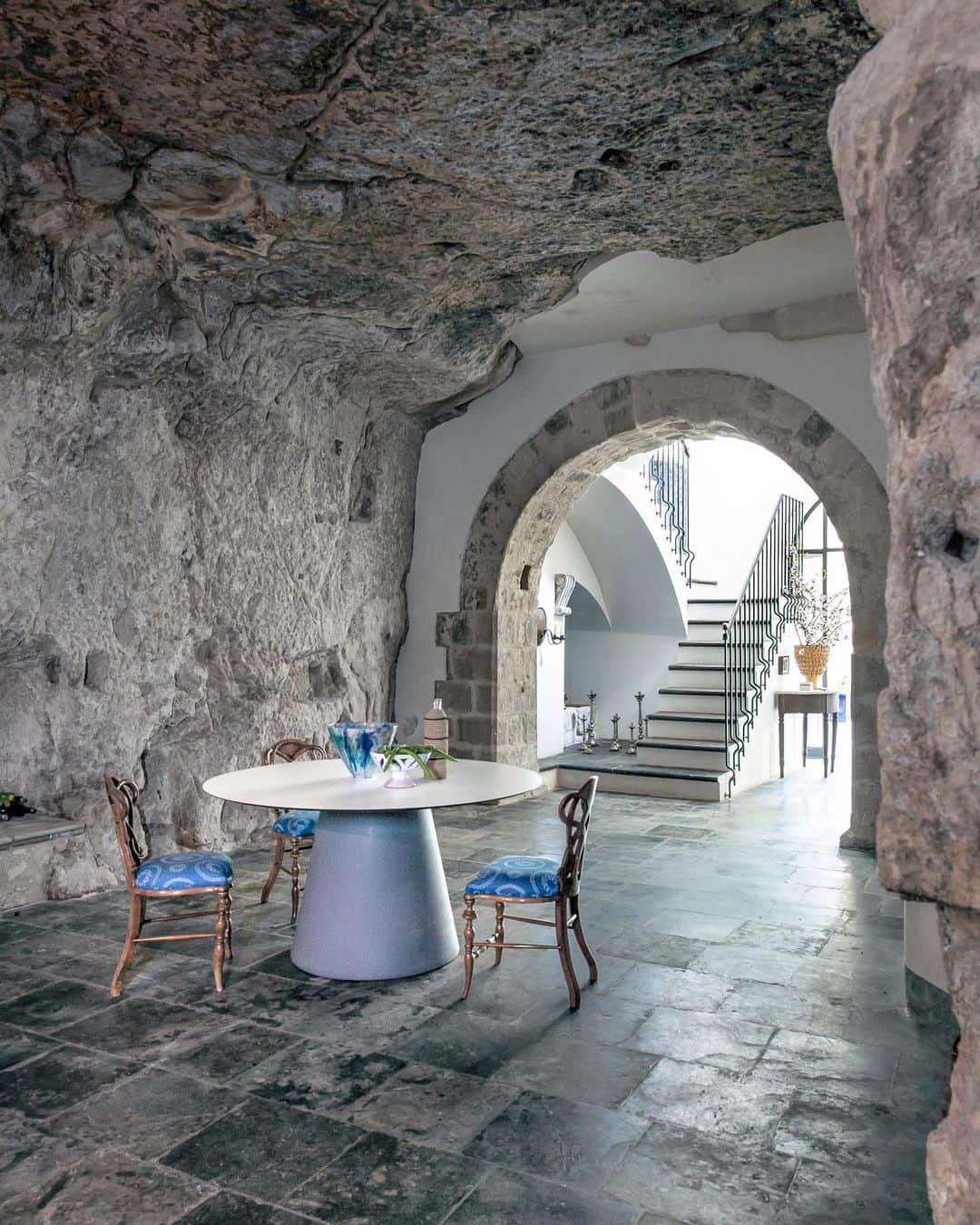 ELLE DECORさんのインスタグラム写真 - (ELLE DECORInstagram)「“We designed the house to be totally flexible in that 18th-century way,” says ED A-Lister Bill Brockschmidt, of @brockschmidtandcoleman, about his home in Sicily. Brockschmidt restored the palazzo with his partner and architectural designer Richard Dragisic. The lower level of the home, a circa–600 b.c. cave, now doubles as a dining and party room where they throw lavish parties with friends old and new.  Here, the table is by @serralunga.official and the antique chairs were bought at auction in Palermo. Click the link in bio for the full house tour, as seen in our May 2020 issue. Photography by @sylviebecquet.」4月29日 0時01分 - elledecor