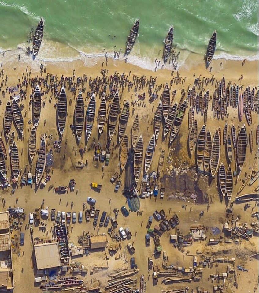National Geographic Travelさんのインスタグラム写真 - (National Geographic TravelInstagram)「Photo by George Steinmetz @geosteinmetz  #onassignment for @natgeo Artisanal fishing boats offloaded their catch on the beach of Nouakchott last week.  Mauritania has one of the most productive fisheries in West Africa, but Mauritanians are largely a desert people who don't eat fish, making for a lucrative export business. I flew over this same beach in 1997 and was curious to see how things have changed.  Urban Africa is indeed a very dynamic place.  Go to @geosteinmetz to see for yourself.」5月18日 9時06分 - natgeotravel