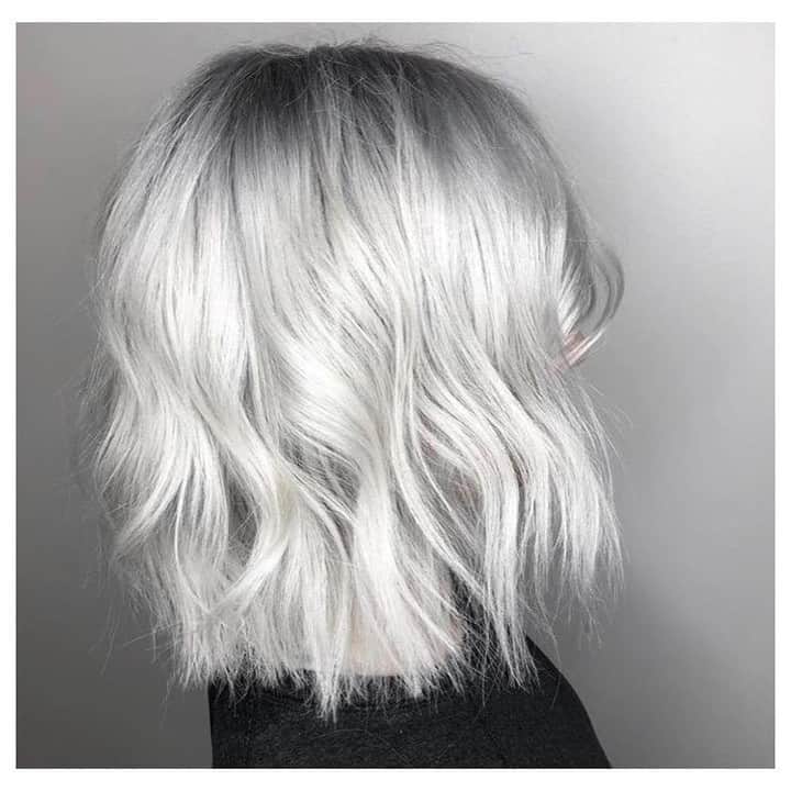 CosmoProf Beautyさんのインスタグラム写真 - (CosmoProf BeautyInstagram)「Wonderful White⚪️ ✨ She comes in every 5-6 weeks for a platinum root retouch (in order to avoid banding). Once a week she does an @olaplex treatment and sleeps in it, uses salon quality shampoo, conditioner & styling products. THIS HAIR IS EXPENSIVE, TIME CONSUMING and a COMMITMENT!!! This hair is NOT for everyone. ✨ Root retouch with @kenraprofessional Creme Lightener, @trionicshaircare Actuator and Lift Thru, and Olaplex. Processed with cap for 45 mins. Pulled through the rest of the hair that was coated in Olaplex 2 with Kenra Creme Lightener and Trionics Accent for 7 mins. Rinsed and shampooed with @malibucpro Crystal Gel followed by Olaplex 2 for 20 mins. Rinsed, shampooed and towel dried. Lifted to a level 9-10. Pretoned with Kenra SV and equal parts DF (diamond Frost) for 5 mins at the bowl. ✨ Root shade (on thoroughly towel dried hair) is @kenraprofessional 8VM with equal parts 8SM with Trionics Accent and Olaplex. 10SM with Trionics Accent and Olaplex for the rest of the hair. 25 mins processing time, rinsed, shampooed and styled with @kenraprofessional Platinum Styling products. Sent her home with @keracolorhair Platinum Clenditioner to maintain her icy locks at home. Hair by: @saraihairwizard ✨ #cosmoprofbeauty is proud to support those whose are #licensedtocreate . . . . . #repost #trionics #trionicshaircare #trionicsactuator #olaplex #olaplexlove #kenra #kenraprofessional #keracolor #keracolorclenditioner #malibucpro #blondehair #blondespecialist #whitehair #whiteblonde #coolblonde #platinumhair #platinumblonde #icyblonde #iceblonde #silverhair  #dimensionalblonde #dimensionalcolor #paintedhair #colorspecialist #haircoloring #styleartists」5月12日 5時00分 - cosmoprofbeauty