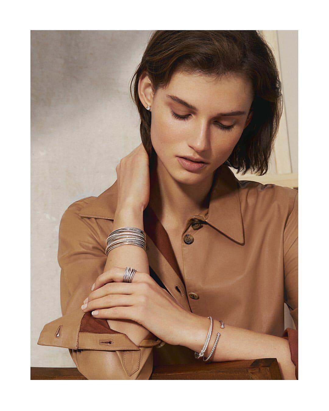 デビッドヤーマンのインスタグラム：「Our favorite spring layers. • New designs from The Crossover Collection® bring rhythmic lines and dynamic beauty to a Cable bracelet and diamond studs. Shop our latest arrivals through our bio link. • #DavidYurman #StackableJewelry」