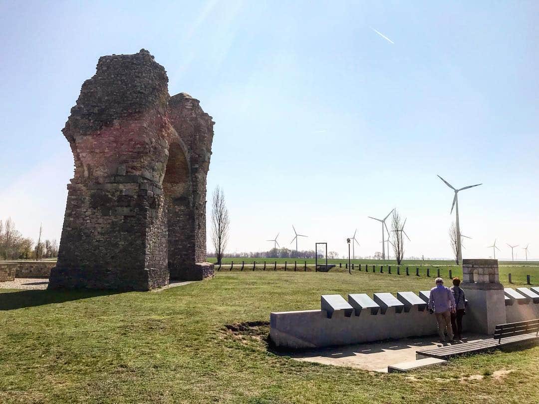 トミー・コールドウェルのインスタグラム：「I came across this Roman gate that was built (351-361 AD)  near the edge of the Austrian Slovak border. It’s made of recycled products and surrounded by a very serene feeling field of wind turbines. I thought it made an interesting portrait of environmental practices throughout the ages (intended or not) In most of the US it is now less expensive  to build and operate solar power plants than it is to maintain current coal plants. This is because Germany invested heavy in solar  years ago. This made it financially viable for China to get really good at mass production of PV panels which drove down the cost for the entire world. Lower carbon technologies are progressing at an incredible rate. But it takes the world coming together.」