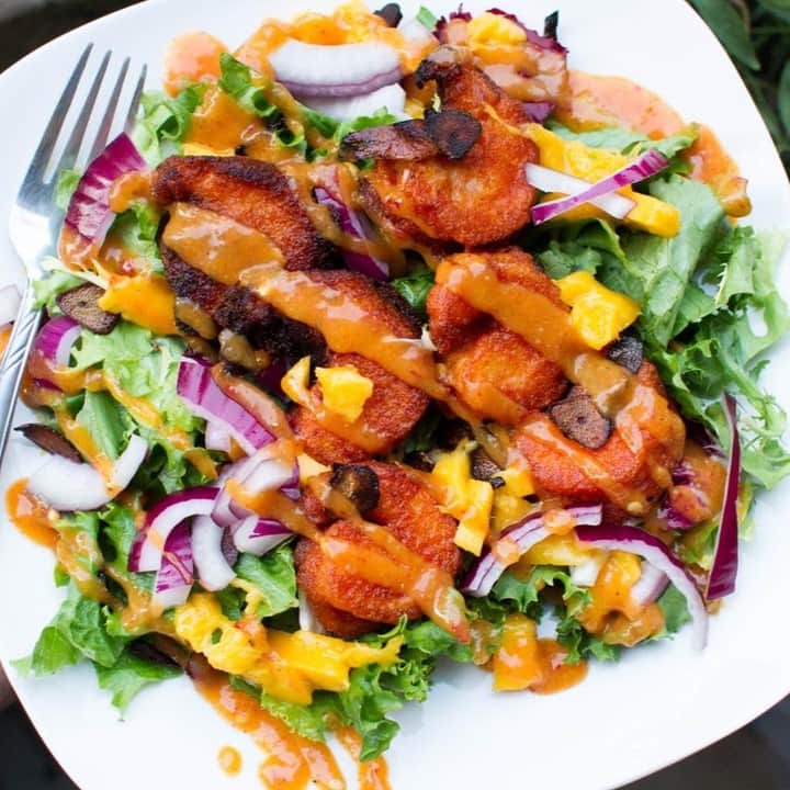 Flavorgod Seasoningsさんのインスタグラム写真 - (Flavorgod SeasoningsInstagram)「Sweet and Tangy Crispy Shrimp Salad 🍤🥗⁣ .⁣ Made with:⁣ 👉 #flavorgod Fiesta Sweet & Tangy ⁣ -⁣ On Sale here ⬇️⁣ Click the link in the bio -> @flavorgod⁣ www.flavorgod.com⁣ .⁣ Ingredients:⁣ * 1 lb shrimp, peeled and deveined⁣ * 1 tbsp tapioca starch or cassava flour⁣ * 1/4 cup cassava flour⁣ * 2 tbsp FlavorGod Sweet and Tangy⁣ * 1/2 tsp black pepper⁣ * soda water⁣ * salad mix⁣ * 1/4 ripe mango, peeled and cubed⁣ * 1 tsp shallots⁣ * 1 garlic clove⁣ * 1 tsp apple cider vinegar⁣ * 1 tbsp olive oil⁣ * salt and pepper to taste⁣ ⁣ Preparation:⁣ 1. Dust the shrimp with 1 tbsp tapioca starch or cassava flour. In a separate bowl, mix together the 1/4 cup cassava flour with 2 tbsp FlavorGod Sweet and Tangy, and black pepper. Add the soda water 1 tbsp at a time until you have a thick batter. Whisk to combine. ⁣ 2. Heat 1/4 inch of oil in a heavy bottom pan (avocado, coconut oil, or other high heat oil) over medium heat. Dip each shrimp in the batter to coat. Shake off excess and carefully place into hot oil. Fry each side for about 1 minute. Remove from oil and drain on a cooling rack. Repeat for remaining shrimp.⁣ 3. Prepare the dressing by combining the mango, garlic, shallot and 1 tsp of FlavorGod Sweet and Tangy in a food processor/blender. Puree. In a clean bowl, take 2 tbsp of the mango mixture and whisk in the apple cider vinegar and olive oil. Season with salt and pepper to taste. ⁣ 4. To assemble the salad, add the crispy shrimp to your favorite salad mix and dress with the mango dressing. ⁣」4月5日 10時00分 - flavorgod