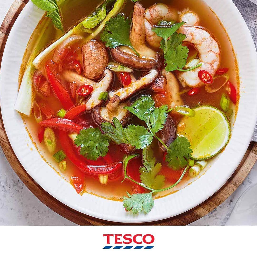 Tesco Food Officialさんのインスタグラム写真 - (Tesco Food OfficialInstagram)「It’s called tom YUM for a reason. This Thai soup is a swirling celebration of bold, refreshing spices, big juicy prawns and tender shiitake mushrooms - treat yourself to a very special Friday night #FakeAway.⁣ ⁣ Ingredients⁣ 1 tsp vegetable oil⁣ 2 large tomatoes, deseeded and finely chopped⁣ 1 vegetable or fish stock pot, made up to 850ml⁣ 2 lemongrass stalks, lightly bashed⁣ 2 shallots, finely sliced⁣ 20g fresh coriander, finely chopped, stalks separated⁣ 1 red pepper, thinly sliced⁣ 1 garlic clove, crushed⁣ 1 star anise⁣ 2 kaffir lime leaves (optional)⁣ 75g shiitake mushrooms, halved⁣ 1 pak choi, quartered lengthways⁣ 165g pack Tesco Finest raw jumbo king prawns⁣ 3 tbsp fish sauce⁣ 2 spring onions, finely sliced⁣ 1 red chilli, thinly sliced⁣ 1 lime, halved⁣ ⁣ Method⁣  1. Heat the oil in a large saucepan over a medium-high heat. Add the tomatoes and cook for 3-4 mins until soft and saucy.⁣ 2. Add the stock, lemongrass, shallots, coriander stalks, red pepper, garlic, star anise and lime leaves, if using. Bring to a simmer and bubble over a medium heat for 15 mins to infuse.⁣ 3. Add the mushrooms, pak choi and prawns and cook for 3 mins until the prawns turn pink and are cooked through. Stir through the fish sauce.⁣ 4. Discard the lemongrass. Serve the soup in bowls, garnished with the spring onions, coriander leaves, chilli and a squeeze of fresh lime.」4月5日 21時14分 - tescofood