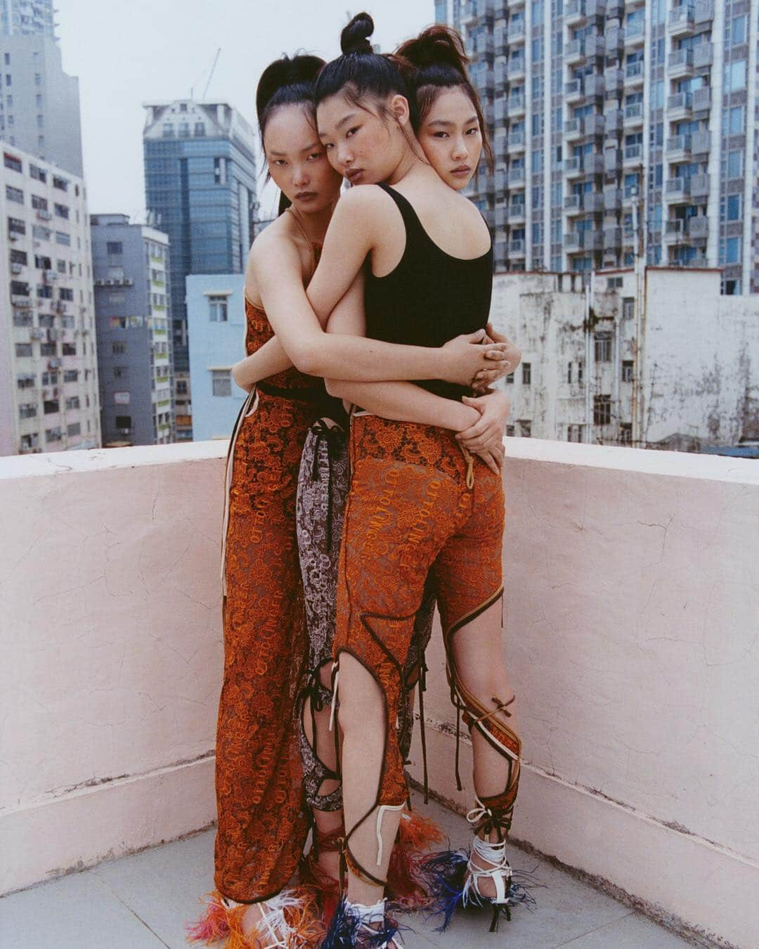 i-Dさんのインスタグラム写真 - (i-DInstagram)「Two's company ➡ Three's a party! 🤗⁣⁣ ⁣ For The Homegrown Issue of i-D, @alexleese and @bojana_koz capture the fashion designs of the moment on a beautifully grey Hong Kong day. 🇭🇰💖⁣⁣ ⁣ 👇Tag someone you can’t wait to hug this weekend and then hit the link in bio to see more of this gorgeous shoot. 🔗⁣⁣ ⁣ [The Homegrown Issue, no. 355, Spring 2019]⁣⁣⁣ .⁣⁣ .⁣⁣ .⁣⁣ Photography @alexleese⁣⁣ Styling @bojana_koz⁣⁣ Image 1: Hoyeon wears all clothing @marineserre_official. ⁣⁣ Yoon wears corset Andreas Kronthaler for @viviennewestwood. Shoes @asaitakeaway.⁣⁣ Image 2: ing wears top @ottolinger1000. Briefs stylist's own. Shoes Asai. Hoyeon wears top @normakamali. Trousers Ottolinger. Shoes Asai. Yoon wears leotard @wolford. Trousers Ottolinger. Shoes Asai.⁣⁣ #Fashion #HongKong #Asai #MarineSerre #VivienneWestwood #OttolInger」4月5日 21時20分 - i_d