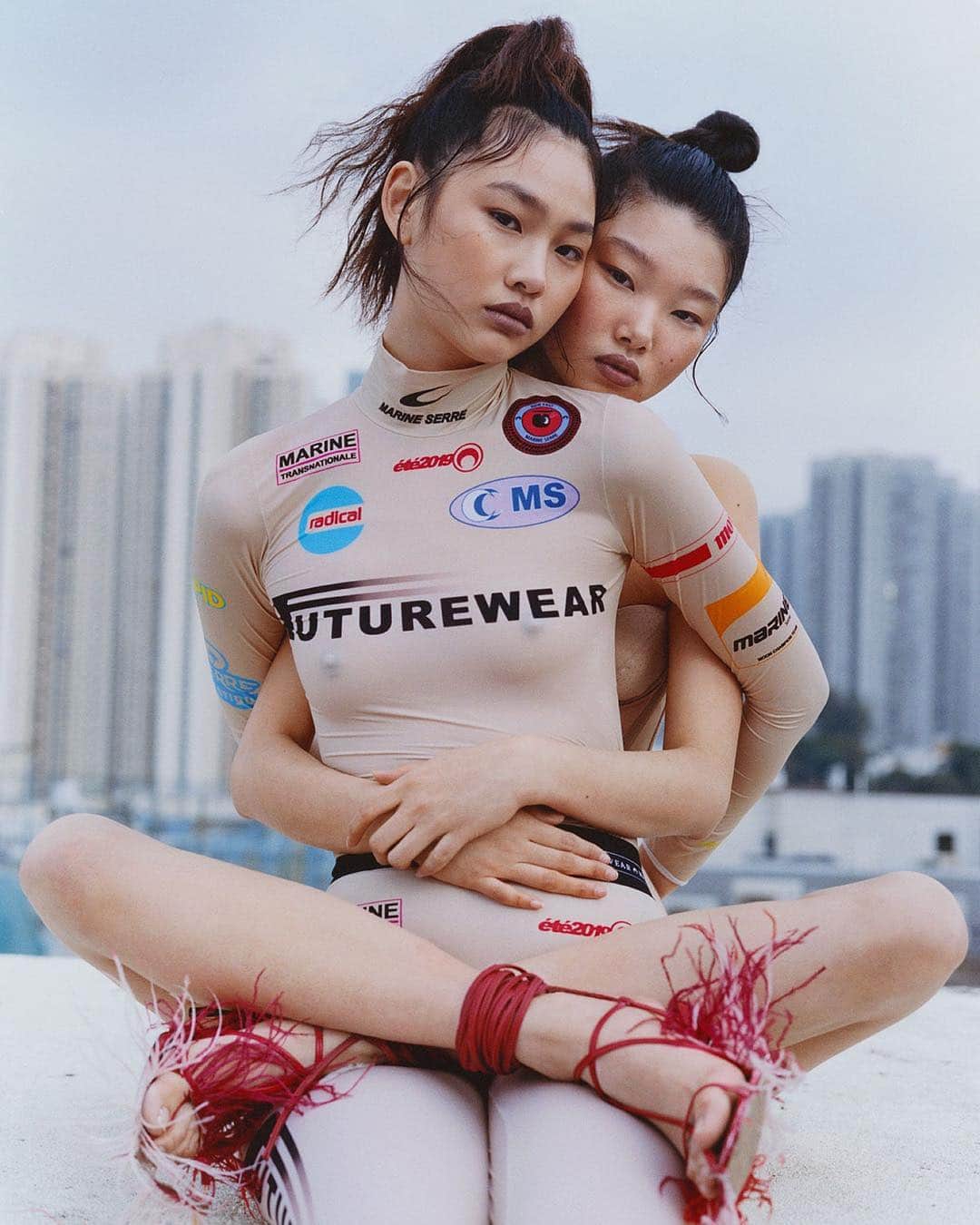 i-Dさんのインスタグラム写真 - (i-DInstagram)「Two's company ➡ Three's a party! 🤗⁣⁣ ⁣ For The Homegrown Issue of i-D, @alexleese and @bojana_koz capture the fashion designs of the moment on a beautifully grey Hong Kong day. 🇭🇰💖⁣⁣ ⁣ 👇Tag someone you can’t wait to hug this weekend and then hit the link in bio to see more of this gorgeous shoot. 🔗⁣⁣ ⁣ [The Homegrown Issue, no. 355, Spring 2019]⁣⁣⁣ .⁣⁣ .⁣⁣ .⁣⁣ Photography @alexleese⁣⁣ Styling @bojana_koz⁣⁣ Image 1: Hoyeon wears all clothing @marineserre_official. ⁣⁣ Yoon wears corset Andreas Kronthaler for @viviennewestwood. Shoes @asaitakeaway.⁣⁣ Image 2: ing wears top @ottolinger1000. Briefs stylist's own. Shoes Asai. Hoyeon wears top @normakamali. Trousers Ottolinger. Shoes Asai. Yoon wears leotard @wolford. Trousers Ottolinger. Shoes Asai.⁣⁣ #Fashion #HongKong #Asai #MarineSerre #VivienneWestwood #OttolInger」4月5日 21時20分 - i_d