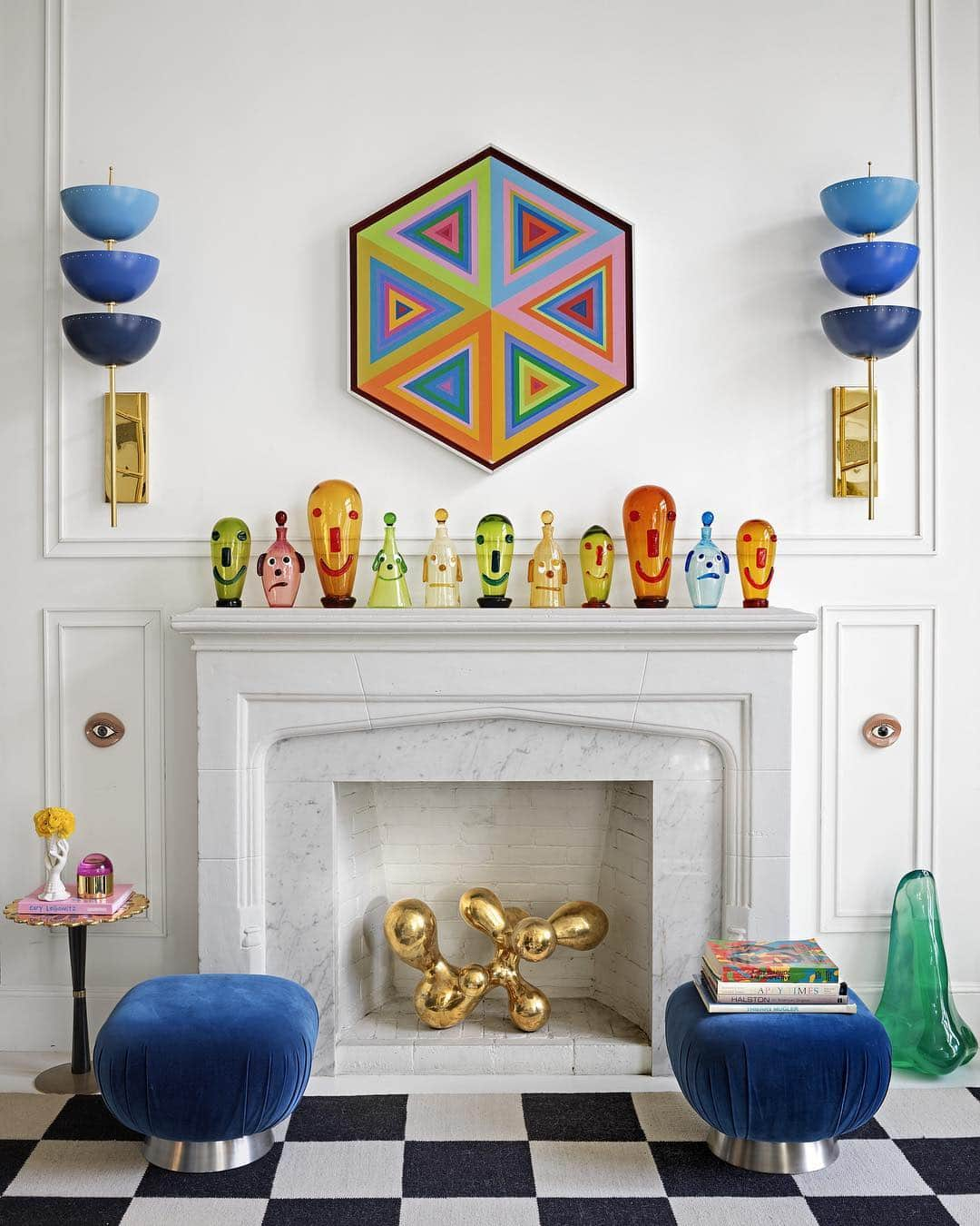 ELLE DECORさんのインスタグラム写真 - (ELLE DECORInstagram)「The living room of @jonathanadler and @simondoonan’s New York home features curated treasures, including an original marble mantel that holds a collection of vintage Italian glass figurines. The tuffets, sconces, and sculptures are all by Adler, and the artwork over the mantel is vintage. Click the link in bio for the full tour, as seen in our April issue. Photography by @thefacinator」4月6日 6時51分 - elledecor