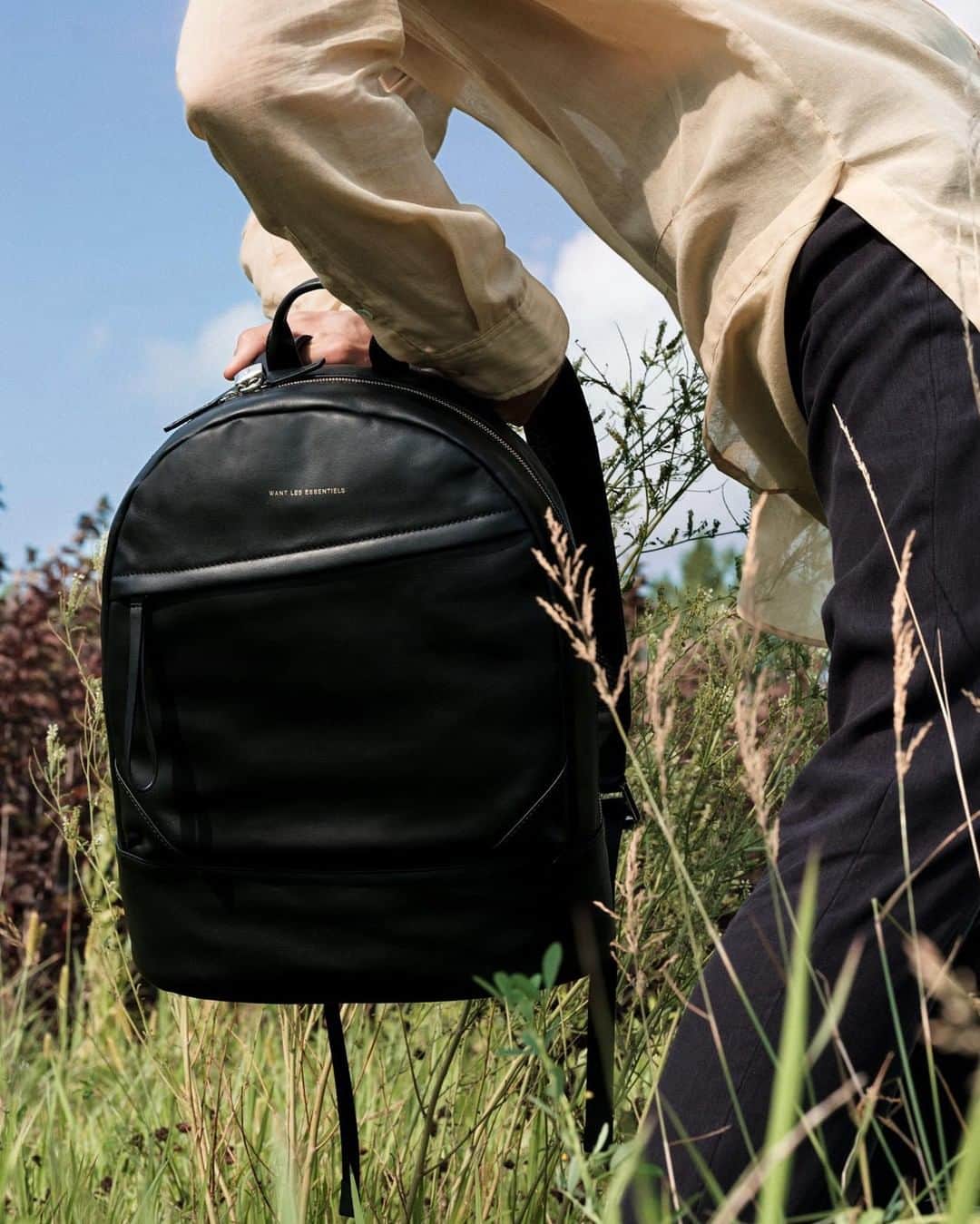 のインスタグラム：「The iconic Kastrup backpack features thoughtful details to bring hands-free living to a whole new level. Featuring maximized interior compartments, free-standing base & custom padlock and keys makes this the ideal utility piece. — #wantlesessentiels #travel #fashion #details」