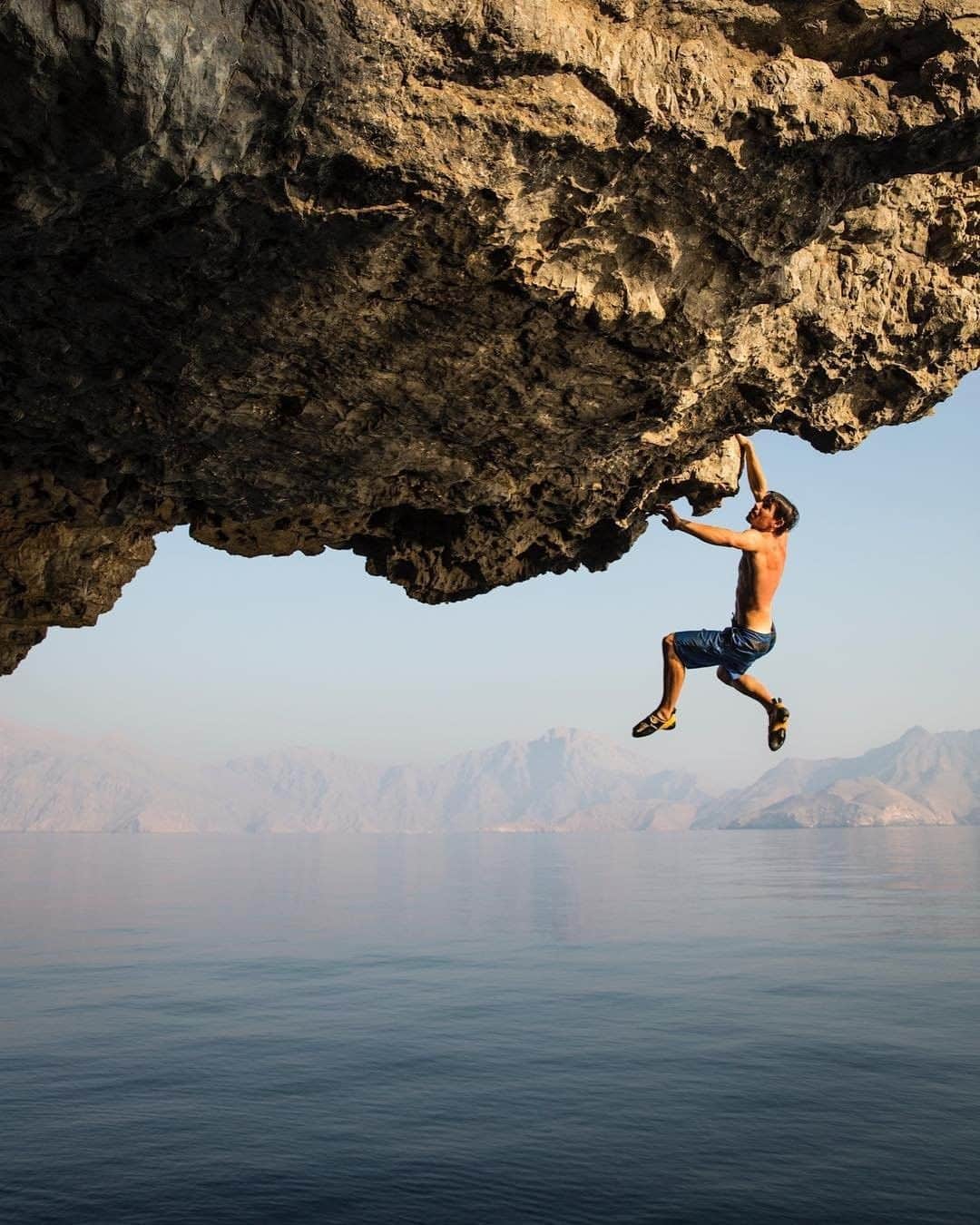 National Geographic Travelさんのインスタグラム写真 - (National Geographic TravelInstagram)「Photo by @jimmychin | Deep-water soloing is a form of climbing without ropes above water. @alexhonnold is footloose and free on the Musandam Peninsula in Oman. Shot on assignment for @natgeo. To see more climbing adventures around the world, follow @jimmychin」4月6日 19時03分 - natgeotravel