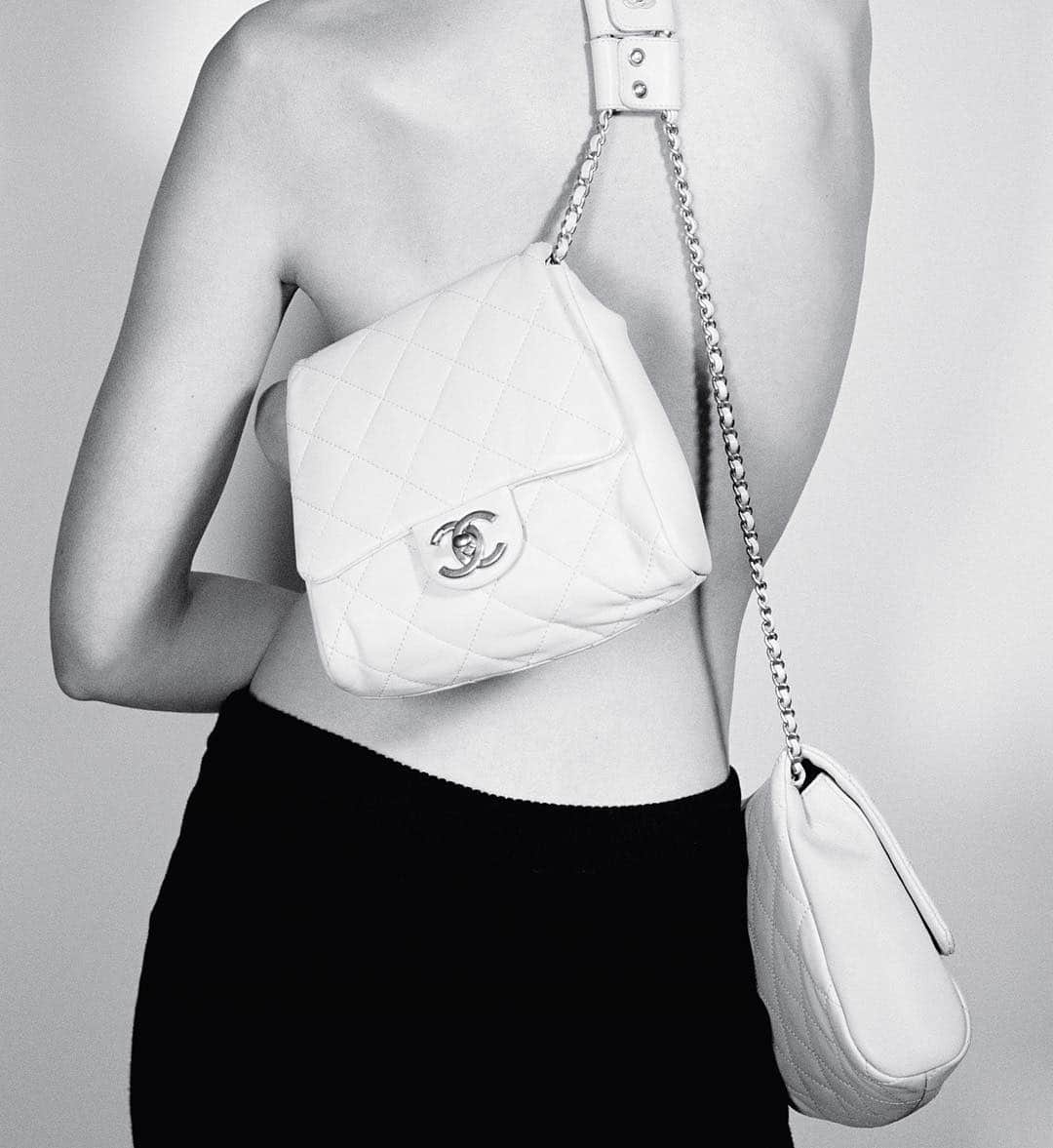 AnOther Magazineさんのインスタグラム写真 - (AnOther MagazineInstagram)「In 1929, Gabrielle Chanel designed her first handbag. Taking inspiration from soldiers’ military-issue knapsacks, she added a strap – much to the disdain of the upper echelons of society who found such pragmatism uncouth. “I got fed up with holding my purses in my hands and losing them,” she said at the time, “so I added a strap.” As with several of Chanel’s innovations, it came from practicality but would inevitably transform the very idea of elegance, reconfiguring fashion as just another tool in the liberation of the modern woman. Today, this @chanelofficial’s side-pack features two smaller purses attached to a harness-like chain, worn any which way ⛓⁣⠀ ⁣⠀ 📷 from AnOther Magazine S/S19, shot by @chris.rhodes and styled by @chloe_grace_press」4月7日 3時18分 - anothermagazine
