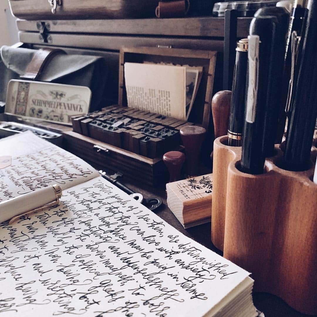 Catharine Mi-Sookさんのインスタグラム写真 - (Catharine Mi-SookInstagram)「“There was something very comfortable in having plenty of stationery.” -Charles Dickens . . Aside from the wild wild woods, my creative nook at home is my sweet respite. From analogue to tech, vintage treasures and gadgets alike, I love having this space to create and clear the dust off of my soul. Aesthetic has always been an important detail of any space I live or work in; it brings beauty within the atmosphere and that alone elevates brainstorms and productivity for me, whether I’m having recreational time or focusing on projects and tasks. Today has been a conglomeration of both, but here is a peek of my unwinding time. Oh and thank you to everyone who graciously sent stamp and scrapbooking recommendations to me, by the way! I love expanding my repertoire further out into various creative mediums. Wishing you all a wonderful rest of the week! What detail of your day has been inspiring you? . . . . #dailyjournal #mujjo #leatherphonecase #journaling #pelikan #pelikanpen #fountainpens #sternglas #watchlove #onmydesk #galenleather #loveforanalogue #penmanship #scrapbooklayout #scrapbooking #creativejournal #creativejournaling #stationerylover #ephemera #journalpage #aquietstyle #postitforaesthetic #flatlays #flatlaystyle #flatlaylove #handsinframe #thedailywriting」3月15日 9時58分 - catharinemisook