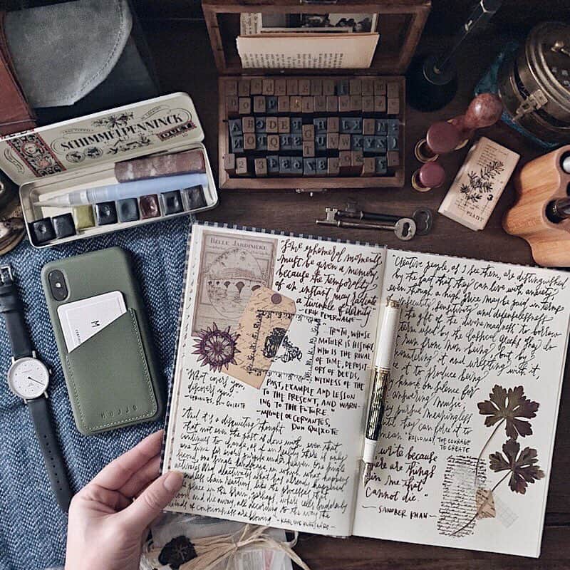 Catharine Mi-Sookさんのインスタグラム写真 - (Catharine Mi-SookInstagram)「“There was something very comfortable in having plenty of stationery.” -Charles Dickens . . Aside from the wild wild woods, my creative nook at home is my sweet respite. From analogue to tech, vintage treasures and gadgets alike, I love having this space to create and clear the dust off of my soul. Aesthetic has always been an important detail of any space I live or work in; it brings beauty within the atmosphere and that alone elevates brainstorms and productivity for me, whether I’m having recreational time or focusing on projects and tasks. Today has been a conglomeration of both, but here is a peek of my unwinding time. Oh and thank you to everyone who graciously sent stamp and scrapbooking recommendations to me, by the way! I love expanding my repertoire further out into various creative mediums. Wishing you all a wonderful rest of the week! What detail of your day has been inspiring you? . . . . #dailyjournal #mujjo #leatherphonecase #journaling #pelikan #pelikanpen #fountainpens #sternglas #watchlove #onmydesk #galenleather #loveforanalogue #penmanship #scrapbooklayout #scrapbooking #creativejournal #creativejournaling #stationerylover #ephemera #journalpage #aquietstyle #postitforaesthetic #flatlays #flatlaystyle #flatlaylove #handsinframe #thedailywriting」3月15日 9時58分 - catharinemisook