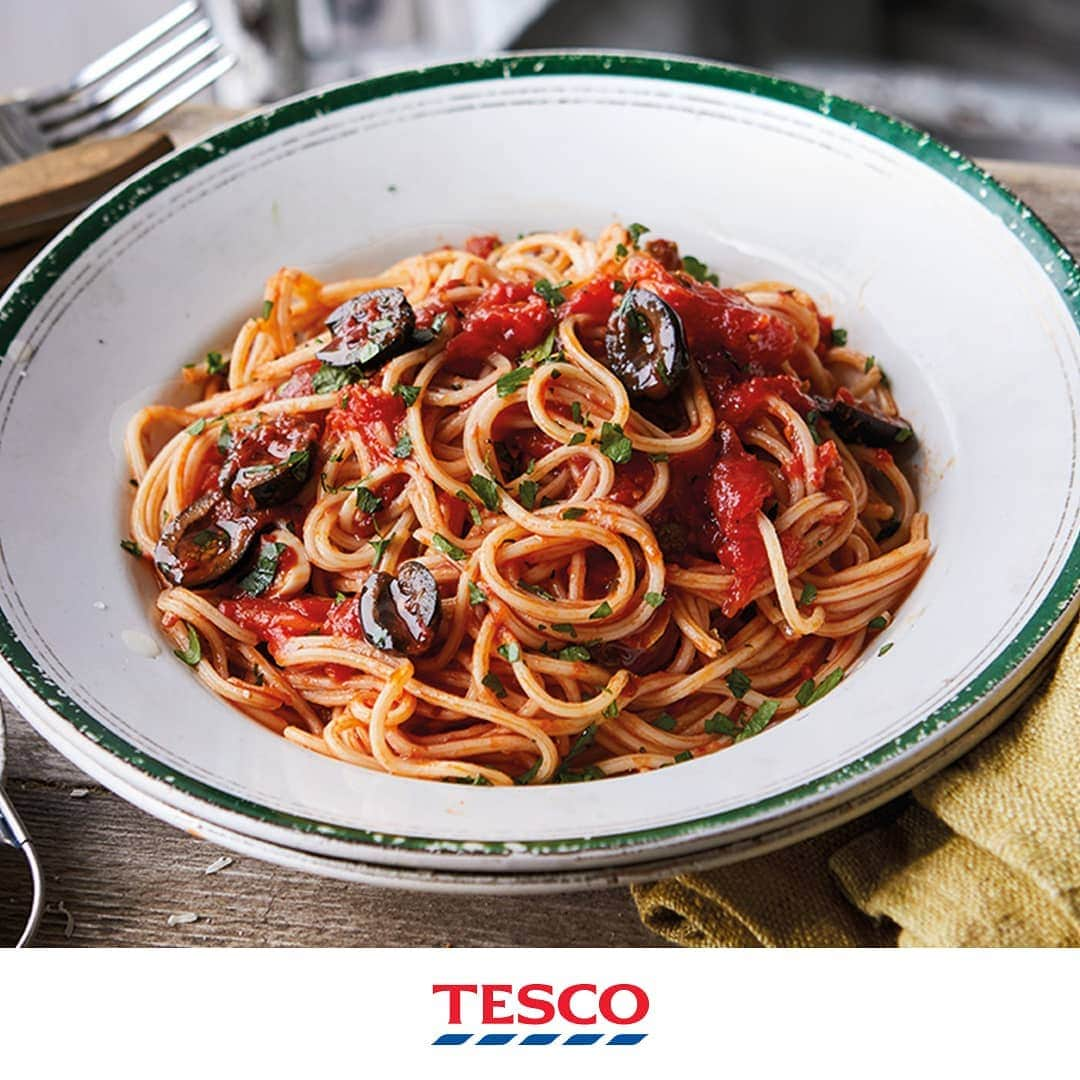 Tesco Food Officialさんのインスタグラム写真 - (Tesco Food OfficialInstagram)「Meet your new favourite pasta - puttanesca! It’s a saucy celebration of amazing mediterranean flavours - olives, chilis and, if you can handle it, anchovies.⁣ ⁣ Ingredients⁣ 2 tbsp olive oil⁣ 2 garlic cloves, finely sliced⁣ ¾ tsp crushed chillies⁣ 1 tbsp capers, rinsed and roughly chopped⁣ 5 anchovy fillets in olive oil, drained⁣ 2 x 400g tins peeled plum tomatoes⁣ 75g black pitted olives, halved⁣ 3 tbsp roughly chopped parsley⁣ 350g spaghetti⁣ grated Parmesan, to serve (optional)⁣ ⁣ Method⁣ 1. Heat the olive oil in a large frying pan over a medium heat and add the garlic and crushed chillies. Cook for 1 min, then add the capers and anchovies. Cook for a further 3-5 mins, until the anchovies have melted into the oil.⁣ 2. Add the tomatoes and break them up with a wooden spoon. Bring the sauce to a simmer and cook for 12-15 mins, stirring occasionally, until the sauce has thickened slightly. Remove from the heat and add the olives and most of the parsley.⁣ 3. While the sauce is simmering, cook the spaghetti to pack instructions.⁣ 4. Drain the spaghetti and add to the pan with the sauce. Toss well to fully coat the pasta. 5. Divide between 4 plates. Garnish with the remaining parsley and grated Parmesan, if using.」3月15日 22時08分 - tescofood