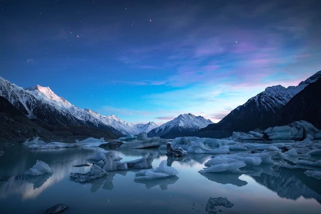 Nikon Australiaさんのインスタグラム写真 - (Nikon AustraliaInstagram)「"With constant weather changes around Mt. Cook in Winter, you never know what you are going to get. So, you just go, again and again. Several times I woke up at 3AM, made the drive over to Tasman Lake, then the 30-45 minute trek in the pitch black to find myself all alone at the lake's shore for some night sky and sunrise shooting. Most of the attempts resulted in less than ideal conditions, but this time the clouds held off just enough to allow for the capture of the stars. Stars shine brightly and reflect upon the aqua coloured lake and ice bergs float nearby, eerily crack and make noises in the dark as they melt and flow into the Tasman River on their journey to Lake Pukaki." - @geoffpiperphotography  Camera: Nikon D850  Lens: Nikon AF-S NIKKOR 14-24 F/2.8G  Settings: 20mm | f/2.8, 15s | ISO 1000⁣  #MyNikonLife #Nikon #NikonAustralia #NikonTop #VisitNewZealand #DiscoverNewZealand #Photography #LandscapePhotography #AstroPhotography」3月15日 14時00分 - nikonaustralia