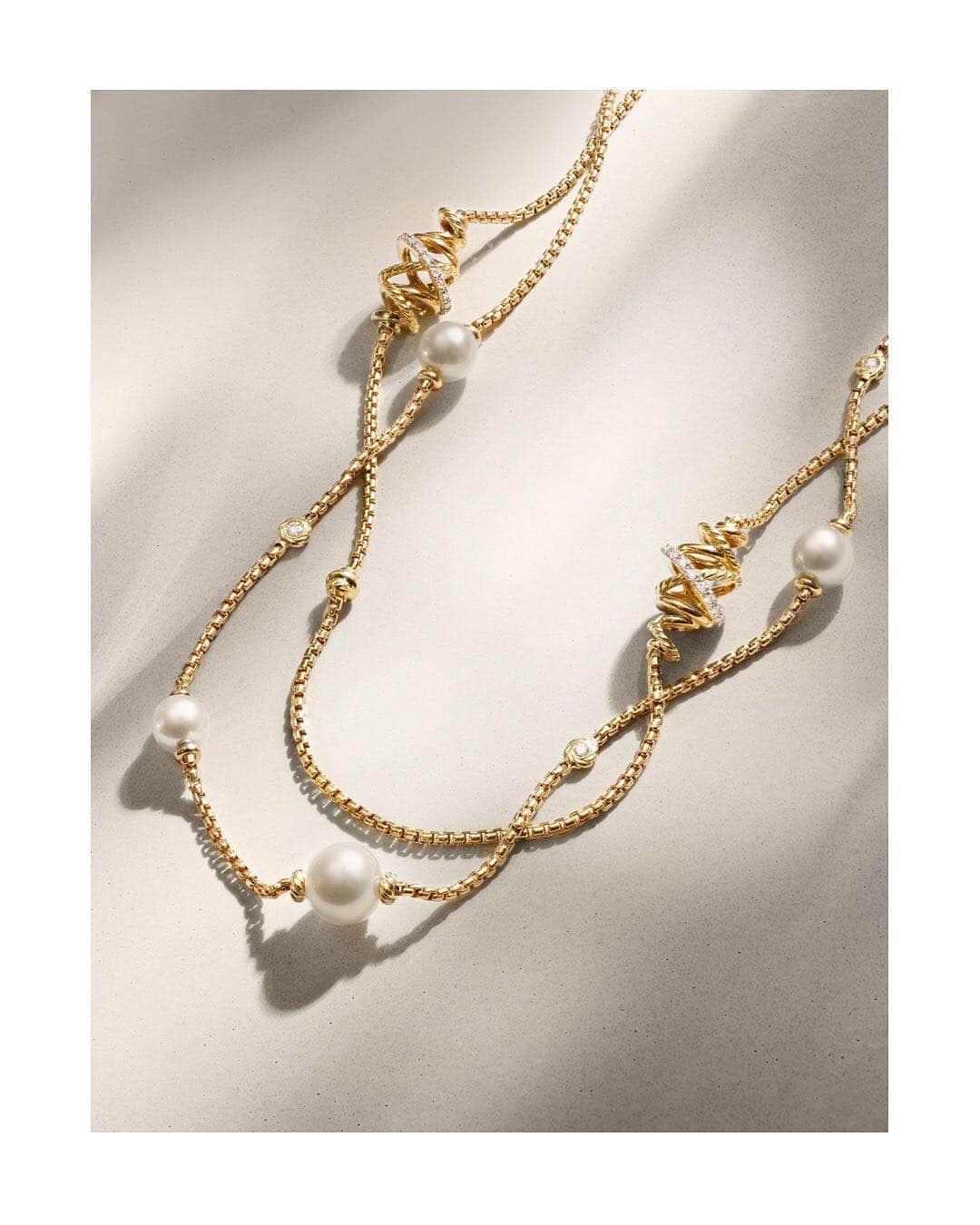デビッドヤーマンのインスタグラム：「All wrapped up. • Strands of Cable, smooth gold and pavé diamonds twist and intertwine in this Crossover station necklace—shown with a Solari pearl chain. • #DavidYurman」