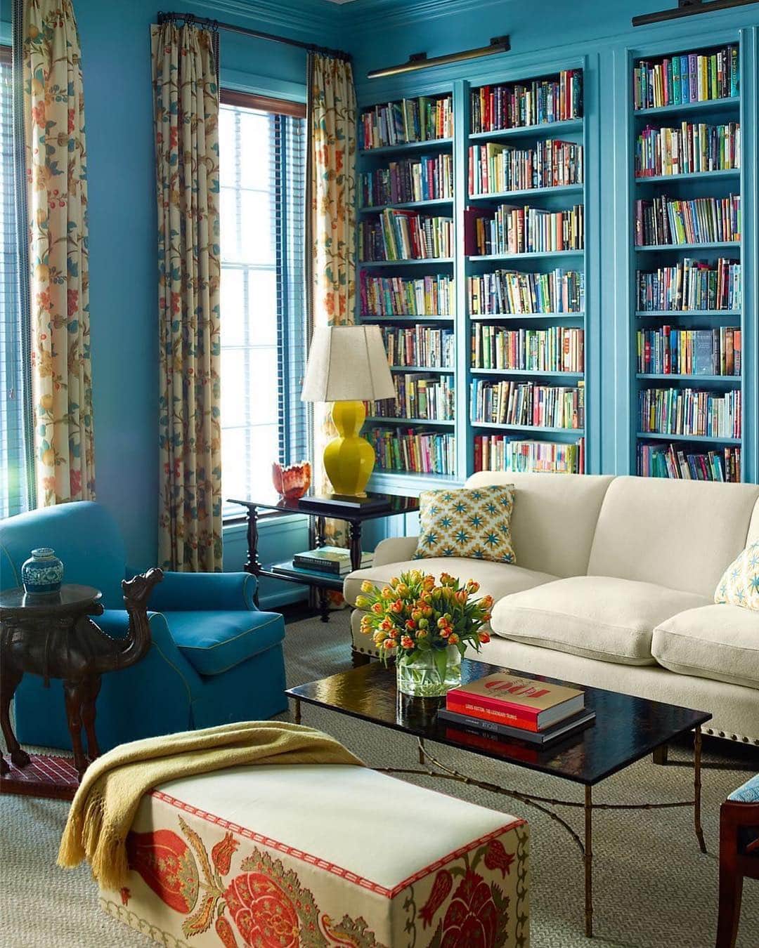 ELLE DECORさんのインスタグラム写真 - (ELLE DECORInstagram)「A bright blue library, as seen in the colorful Manhattan townhouse designed by @katieridderinc. 💙 The sofa and club chair, both by Anthony Lawrence-Belfair, are covered in Holland & Sherry wools, the corner table is from Niall Smith Antiques, the camel side table is from John Rosselli Antiques, and the curtains are in a Quadrille fabric. The walls are painted in C2Paint Luxe in Bewilder. Photography by @ericpiasecki, from the ED archives.」3月16日 5時46分 - elledecor