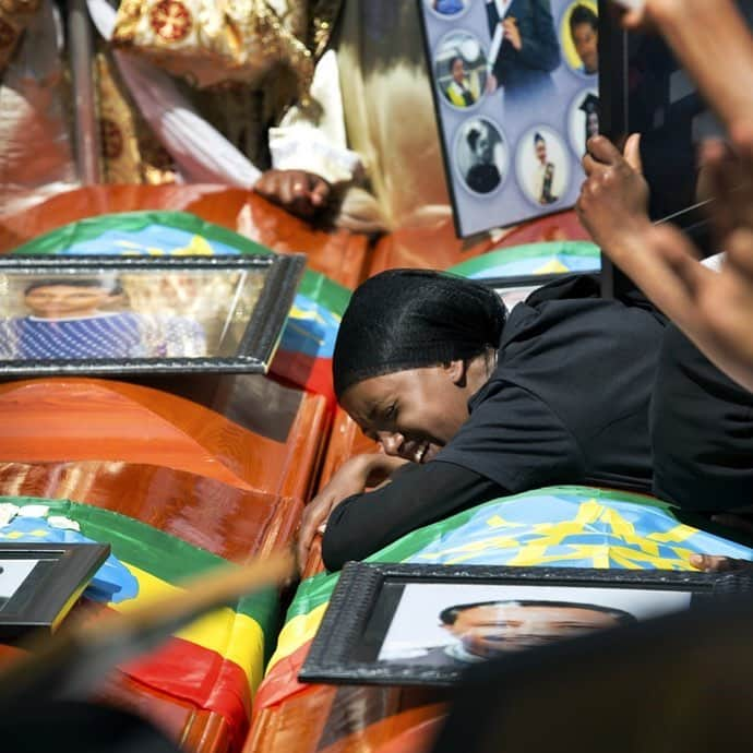 NBC Newsさんのインスタグラム写真 - (NBC NewsInstagram)「Relatives grieve next to empty caskets draped with the Ethiopian national flag at a mass funeral in #AddisAbaba, #Ethiopia. Thousands of people have gathered for the funeral ceremony one week after the #EthiopianAirlines plane crash. Officials have begun delivering bags of earth to family members of the 157 victims of the crash instead of the remains of their loved ones because the identification process is going to take such a long time. . 📷 Mulugeta Ayene / @apnews」3月17日 22時30分 - nbcnews