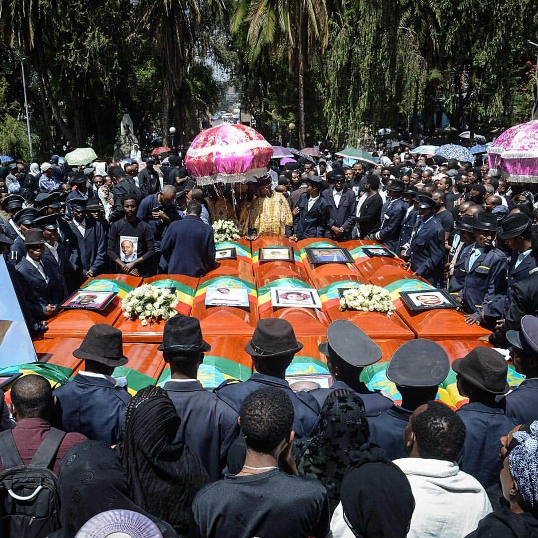 TIME Magazineさんのインスタグラム写真 - (TIME MagazineInstagram)「Thousands of people mourned the 157 victims of the Ethiopian Airlines crash during services on March 17. Seventeen empty caskets draped in the national flag were carried through #AddisAbaba as some victims’ relatives fainted and fell to the ground, @apnews reports. Family members have reported receiving a 2.2 pound (1 kg.) bag of earth that was taken from the site of the crash, instead of the remains of their loved ones that are still being identified. In these photographs: a woman cries over a loved one’s coffin during a service; coffins are gathered during a mass funeral at Holy Trinity Cathedral; and members of a choir sing during a special service for families of the victims at an Ethiopian Orthodox Church in Nairobi. Read more about the investigation into the crash of Flight 302 at the link in bio. Photographs by @jemalcountess—@gettyimages; @samuelhabtab and Yasuyoshi Chiba—@afpphoto/@gettyimages」3月19日 0時53分 - time