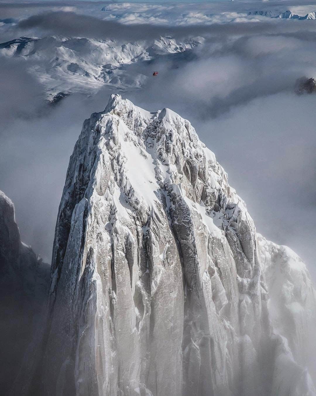 National Geographic Travelさんのインスタグラム写真 - (National Geographic TravelInstagram)「Photo by @jimmychin | Sometimes finding the shot is harder than getting the shot... (Find the heli for scale.) Getting everyone in position on this shoot was another good story and another good image... Purcell Mountains, British Columbia. For more mountain adventures around the world, follow @jimmychin.」3月18日 22時01分 - natgeotravel