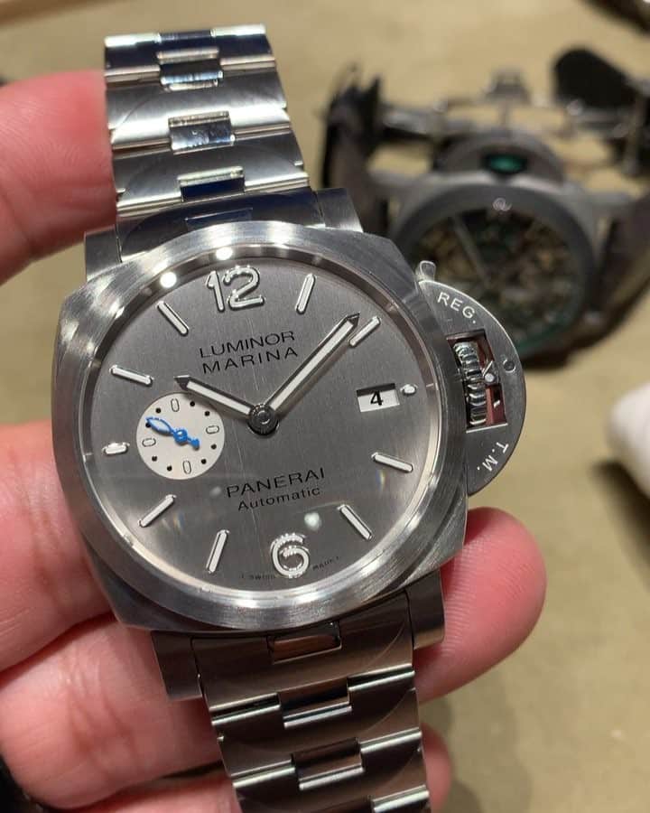 パネライのインスタグラム：「Here’s a hands on look at the newly released #Panerai #PAM977 42mm Luminor Marina on Stainless Steel with the new brushed silver dial and raised numerals. Priced at $8,400 USD #paneraicentral」
