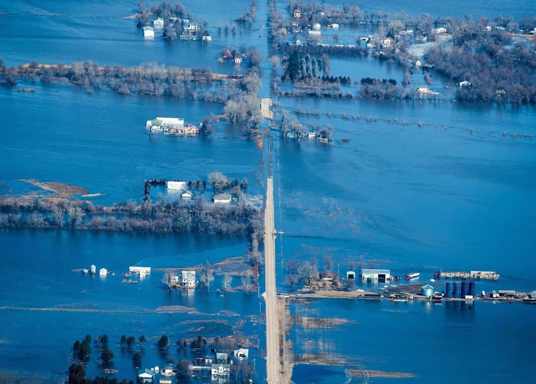 TIME Magazineさんのインスタグラム写真 - (TIME MagazineInstagram)「Parts of the Midwest remain submerged in the wake of "historic and catastrophic flooding," after a bomb cyclone dumped unusual amounts of snow and rain there last week. Several rivers, including the Missouri and the Mississippi, have swelled to dangerous levels, flooding small towns and breaching more than a dozen levees. Emergencies have been declared in at least 74 cities and 65 counties, according to the Nebraska Emergency Management Agency, which described the flooding as one of “the most devastating disasters in recent history.” In this photograph on March 15, water covers a road near Valley, Neb. Read more, and see more pictures, at the link in bio. Photograph by @chrismachian—@omahaworldherald」3月20日 2時20分 - time
