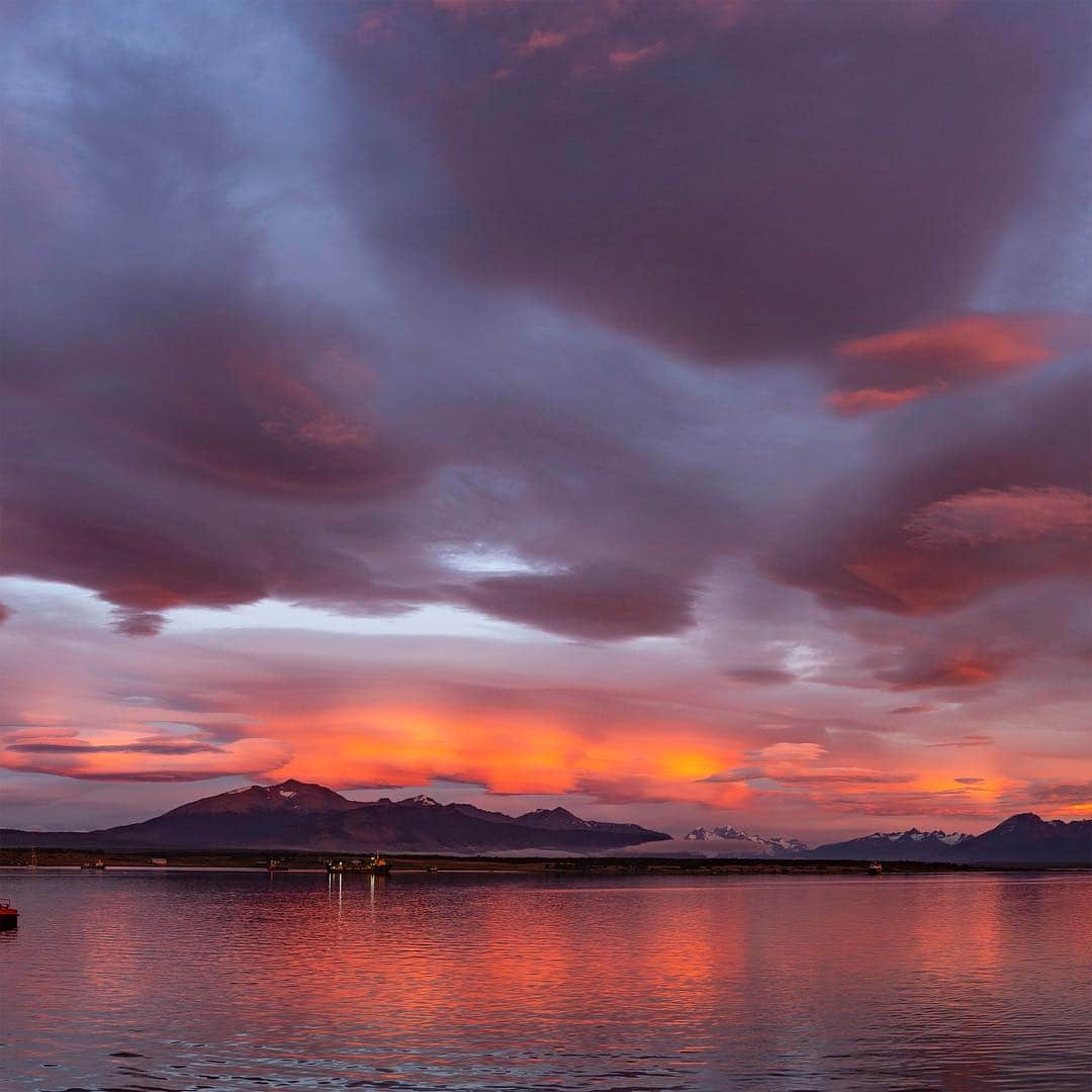 thephotosocietyさんのインスタグラム写真 - (thephotosocietyInstagram)「Photo by @salvarezphoto (Stephen Alvarez) | Puerto Natales, Chile: After three glorious days in the Patagonian Fjords I woke to this dramatic sunrise. Lenticular clouds like these are formed in the troposphere when the rivers of air rise above a surface obstruction. The successive turbulence causes large standing waves of moist air to form striated clouds. They are often the harbinger of rain or snow to come. True to form, the typical Patagonian rain started just 20 minutes after sunrise ended. Shot on assignment for @natgeotravel for more images like this from around the world follow me @salvarezphoto. #lenticular #patagonia」3月20日 21時48分 - thephotosociety