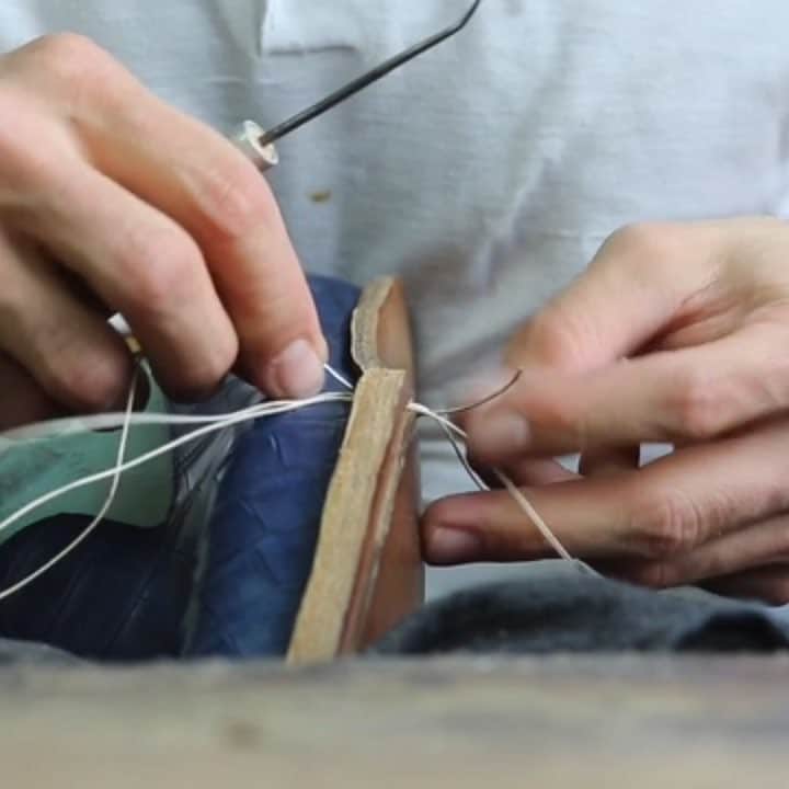 のインスタグラム：「Step 6 | Sole Stitching  As you may already know: all of our shoes are explicitly hand welted & hand lasted - giving us the possibility to achieve our refined and masculine shaped lasts with that extra support for your foot - something we are very proud of.  It is only during the sole stitching process that we use a 80 years old manual crank type MS 200 machine from #Raffenbeul for the outsole stitching process, as we think that the result is not only very similar to a hand stitched sole but also gives the shoe a nicer overall appearance.  Nevertheless we also offer a hand stitched sole upon request - like shown in the video above.  Speaking of the video above - here you can see how the running sole is attached onto the welt and the cork filling in-between both, after what the sole edges are shaped & prepared.  Finally the channel for the sole stitching is cut out and after the sole stitching, the channel is closed and we move on to the heel  #mysaintcrispins #handweltedshoes#saintcrispins #handwelted#forgentlemenonly #forthediscerningfew#shoeproduction #shoeporn #howitsmade」
