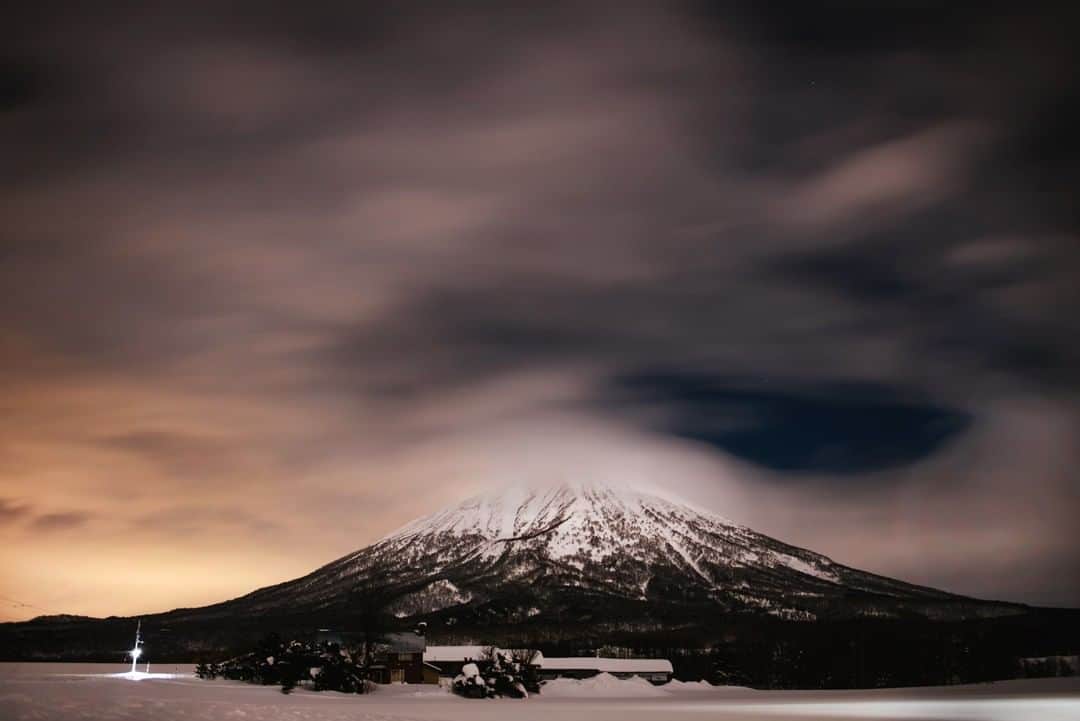 National Geographic Travelさんのインスタグラム写真 - (National Geographic TravelInstagram)「Photo by @max.lowe | Mt Yotei, one of the many massive volcanoes dotting the island of Hokkaido Japan captivates with is immense presence in the landscape as high clouds move in a blur across is steaming summit. Volcanos like no other construct on earth give me a sense of our scale in the grand scheme of the planet, these mouths to the core of our molten orb that is planet earth, revealed in natural ardor brings perspective to just how small we are in the scheme of geological time and place.」3月23日 19時01分 - natgeotravel