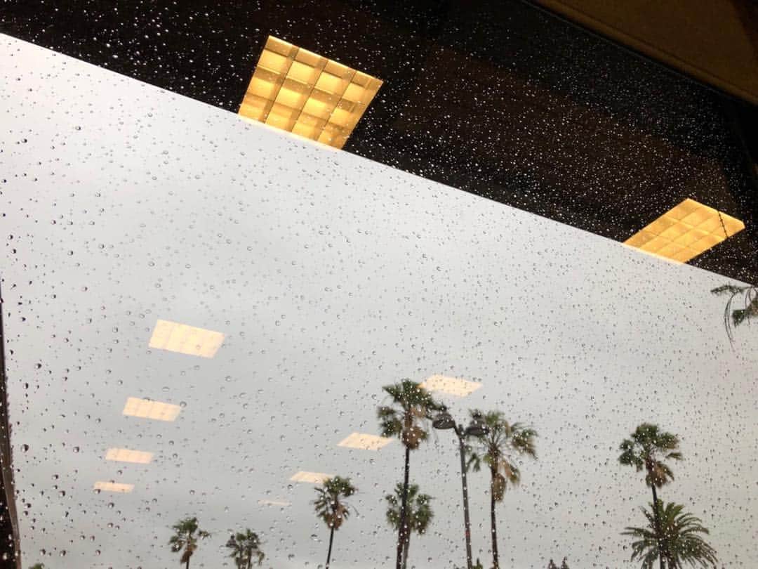 ジョシュ・ブローリンさんのインスタグラム写真 - (ジョシュ・ブローリンInstagram)「I get up to get coffee in the morning. As the truck warms up, the drizzle hits the windshield and I fixate on how each droplet holds a warped and refracted perspective outside. Cool air is blasting through the vents and the skin of my arms prune and I wonder how long it will take for those little explosive pistons to generate enough heat to embrace me this morning. Waylon Jennings sings on the radio.  I watched “The Grapes of Wrath” last night and noted while I watched it how long the camera stayed with people as they spoke, how they let them play out their pains and joys to each other, to us the audience, as if it was some pastime, something we used to do but don’t any longer. Some of the shots were so fake with their painted screens and echo-y voices even though they were supposed to be walking a dirt road outside but it didn’t matter because you take that leap of faith with a story, you let yourself be transported because we want to live as many lives as possible, I think. And Henry Fonda listens well. It’s a plus to see people listening well.  Starbucks doesn’t have the usual hangers on inside so I order my coffee quick from the woman who never gets the order right even though it’s just a coffee with a splash for me and another coffee with a splash of another kind of milk for my wife. While she pours I look outside and there is a quiet to the clouds now, a slow pause almost, and I take a photo with my phone. It’s of the palm trees in the parking lot, the reflections of the lights in Starbucks and those droplets again, following me around everywhere. I look down at the photo and hear from behind me: “Sir? We have two black coffees and...one large milk.”」3月24日 9時42分 - joshbrolin