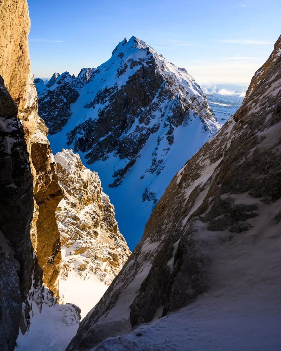 National Geographic Travelさんのインスタグラム写真 - (National Geographic TravelInstagram)「Photo by @taylorglenn | The Middle Teton is framed by the walls of the Stetner Couloir. This image was made late in the afternoon while descending the Grand Teton in Grand Teton National Park, Wyoming. The color of light at this time of day is exquisite, blue hues of the shadows contrasting with the warm sun light. Nothing quite like winter in the mountains. Follow @taylorglenn for more from #Wyoming and beyond. #winter #grandtetonnationalpark」3月24日 10時01分 - natgeotravel