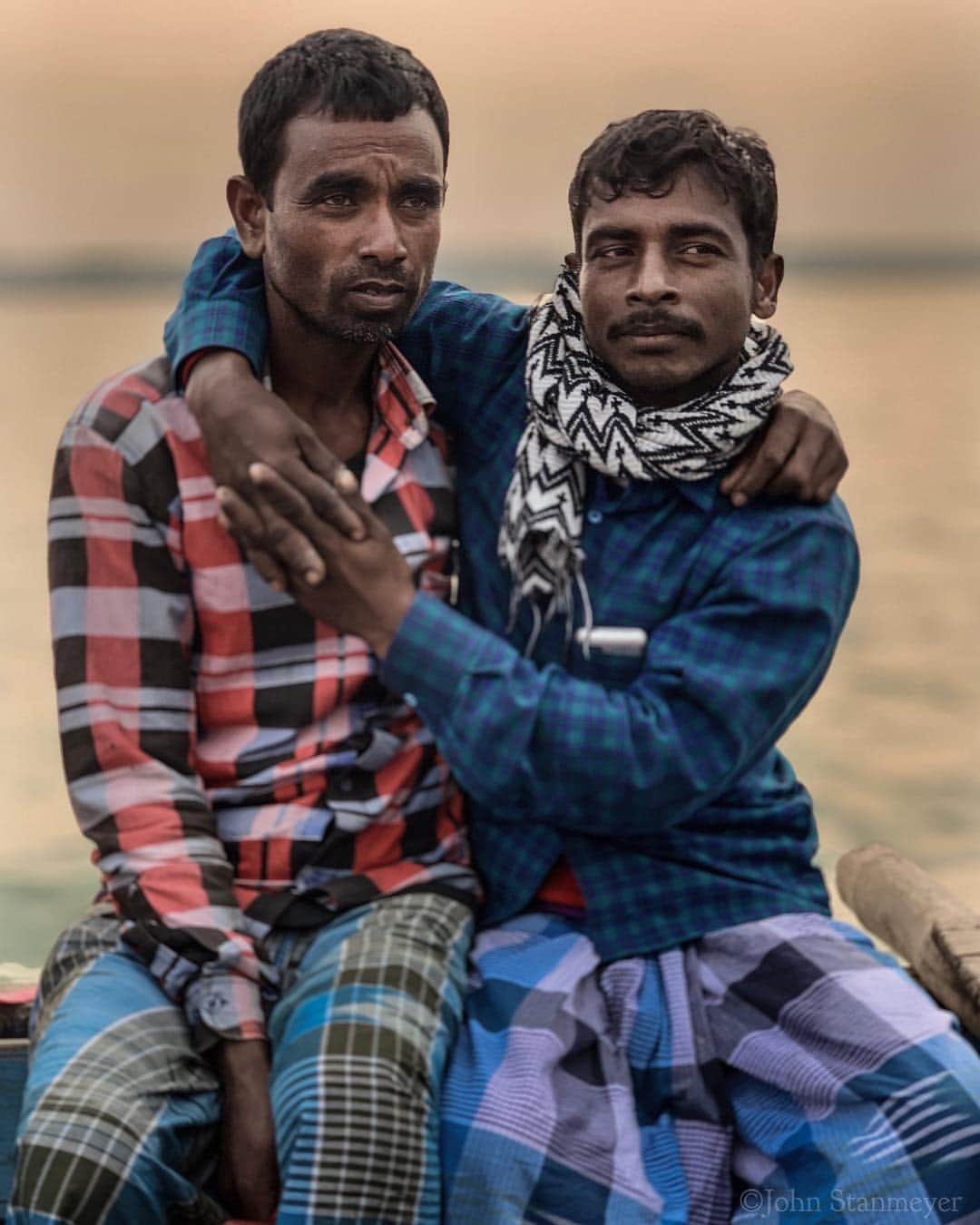 ジョン・スタンメイヤーさんのインスタグラム写真 - (ジョン・スタンメイヤーInstagram)「Dhubri, this town along the Brahmaputra River, continued in giving visualness. Three weeks past when we took a passenger ferry to villages along this historically important waterway, I’m remembering these two men, open in their human friendship, not hiding their humanity of kindness to just a friend. - @natgeo @natgeoimagecollection @outofedenwalk #india #dhubri #assam #portrait #friendship #boat #brahmaputra #brahmaputrariver #sunset」3月24日 13時49分 - johnstanmeyer