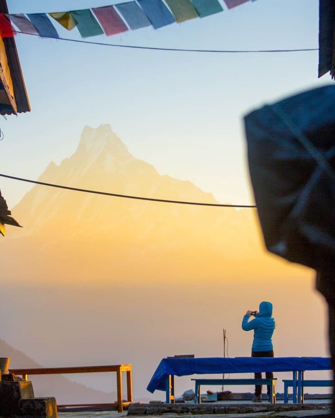 National Geographic Travelさんのインスタグラム写真 - (National Geographic TravelInstagram)「Photo by @emilypolar | An early riser stands in the warm morning light framing up a photo Machapuchare mountain, also known as Fishtail mountain in the Southern Annapurna range of Nepal. To see more of our enchanted world follow @emilypolar #nepal #himalaya #annapurna #tadapani #machapuchare」3月24日 22時05分 - natgeotravel