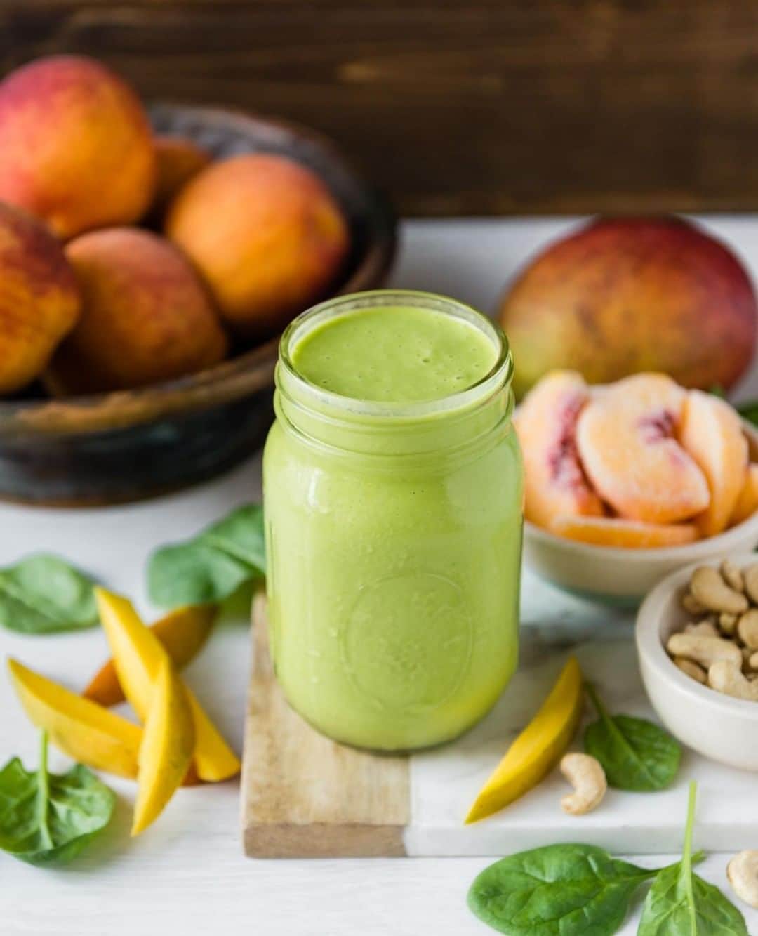 Simple Green Smoothiesさんのインスタグラム写真 - (Simple Green SmoothiesInstagram)「If you're looking for a super creamy, tropical green smoothie that you can use as a meal replacement - this is it! This dreamy, tropical tasting smoothie has all the bases covered - healthy fats, protein, vitamins, and minerals, plus, it tastes great! We've also added coconut oil to give your body an energizing boost while being easy on the digestive system. ⁣ .⁣ P.S. This recipe is pulled straight out of Fresh Start: Spring, currently included in our RAWK THE YEAR membership. For more info on how to get recipes like this click our #linkinbio. ⁣ .⁣ PEACH MANGO CREAM I serves one⁣ .⁣ INGREDIENTS⁣ 1 1/2 cups spinach⁣ 1 cup water⁣ 2 tbsp raw cashews (soaked overnight and drained)⁣ 1 tbsp coconut oil⁣ 1 cup peaches, frozen⁣ 1/2 cup mango, frozen⁣ 1/2 tsp vanilla extract (optional)⁣ .⁣ INSTRUCTIONS⁣ 1. Place spinach, water, cashews, and coconut oil in blender. Blender until smooth.⁣ 2. Add remaining ingredients and blend again.⁣ .⁣ #mealplanning #plantbased #simplegreensmoothies #rawktheyear #rawkstar」3月24日 23時00分 - simplegreensmoothies