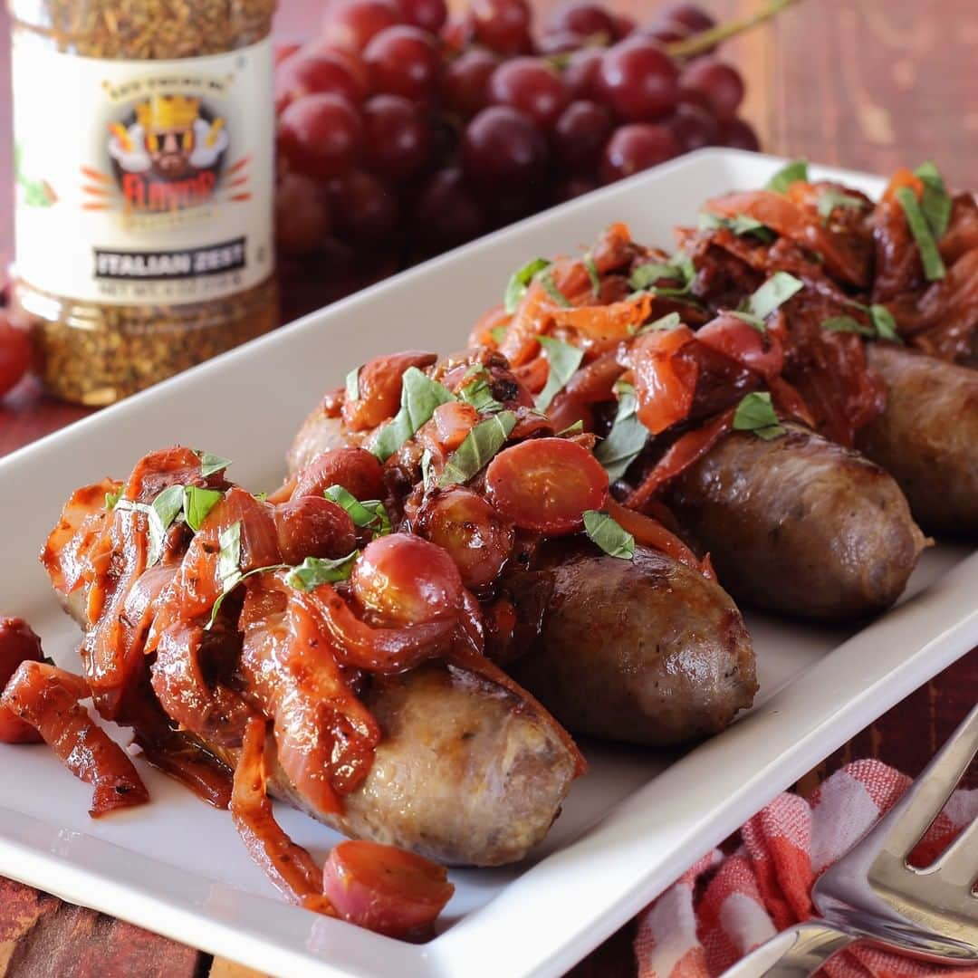 Flavorgod Seasoningsさんのインスタグラム写真 - (Flavorgod SeasoningsInstagram)「ITALIAN SAUSAGE, GRAPES, & CARAMELIZED ONIONS SKILLET MEAL⁣ .⁣ A classic Italian dish made simple and savory with Flavor God ITALIAN ZEST Seasoning.⁣ ⁣ *From @paleo_newbie_recipes:⁣ ⁣ INGREDIENTS⁣ ⁣ 1.5 pounds of uncooked sweet Italian pork sausage⁣ 1 pound seedless red grapes, halved (about 3 cups of sliced grapes total)⁣ 1 tablespoon coconut oil (cooking oil)⁣ 1 white onion, sliced thin⁣ 1/4 cup water⁣ 1/4 cup of dry white wine⁣ 1 tablespoon of Flavor God ITALIAN ZEST Seasoning⁣ 2 teaspoons balsamic vinegar⁣ Sea salt & ground pepper⁣ Garnish with chopped fresh oregano, basil, or mint⁣ ⁣ ⁣ INSTRUCTIONS⁣ ⁣ In 12" skillet, heat oil over medium heat. Add sausages and cook just until browned on both sides – 5 minutes total. Stop and remove skillet from burner to carefully blot up excess oil from the pan with tongs and a paper towel. Add grapes, onions, and water to the skillet and return to the burner. Cover skillet with lid and cook until grapes and onions have softened and internal temperature of sausages reaches 165ºF.⁣ --⁣ Remove cooked sausages from skillet, tent with aluminum foil, and set aside. Heat skillet with onion-grape mixture to medium high. Stir mixture occasionally until browned and most of the liquid has evaporated – around 7-10 minutes. Reduce heat to medium and stir in wine, Flavor God ITALIAN ZEST Seasoning, and a little salt and pepper as desired to taste. Stir until wine has reduced by half. Remove skillet from heat and stir in balsamic vinegar.⁣ --⁣ Serve sausages topped with grape-onion mixture. Garnish with fresh oregano, basil or mint.⁣」4月9日 0時29分 - flavorgod