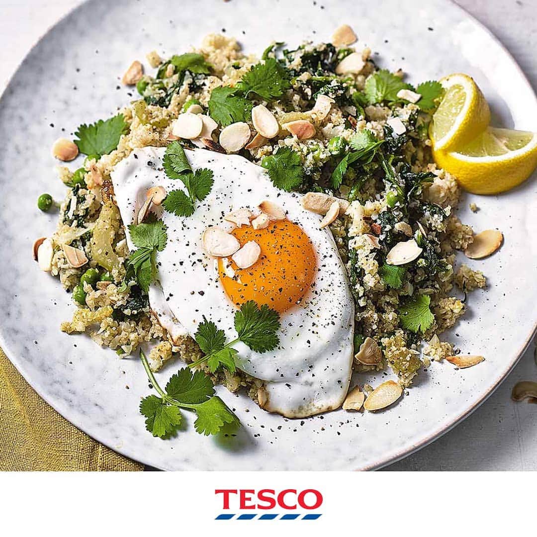 Tesco Food Officialさんのインスタグラム写真 - (Tesco Food OfficialInstagram)「Let's keep that Monday momentum going! This unique spin on pilaf is fast, light and flavour-packed - swapping rice for blitzed veg, nuts and punchy herbs and spices. It's a big bowl of #MeatFree magic. ⁣ ⁣⁣ ⁣ Ingredients⁣⁣⁣ 1 cauliflower (about 1kg), broken into florets⁣⁣⁣ 2 tbsp olive oil⁣⁣⁣ 2 celery sticks, finely sliced⁣⁣⁣ 20g fresh coriander, stalks and leaves chopped and kept separate⁣⁣⁣ 2 tbsp medium curry powder⁣⁣⁣ ½ lemon, zested and juiced, plus wedges to serve (optional)⁣⁣⁣ 1 vegetable stock cube, made up to 100ml⁣⁣⁣ 100g frozen spinach⁣⁣⁣ 150g frozen peas⁣⁣⁣ 4 eggs⁣⁣⁣ 2 tbsp flaked almonds, toasted (optional)⁣⁣⁣ ⁣⁣⁣ Method⁣⁣⁣ 1. Blitz the cauliflower, in batches, in a food processor until it's very finely chopped and resembles rice. Continue until the whole cauliflower has been used up, taking care not to process it too finely.⁣⁣⁣ 2. Put 1 tbsp oil in a large, lidded, nonstick frying pan over a low-medium heat. Add the celery and coriander stalks and cook for 6-8 mins until softened slightly. Add the curry powder and cook, stirring, for 2-3 mins until fragrant, then add the cauliflower rice and lemon zest. Pour over the stock, cover and cook for 5 mins until the cauliflower is tender.⁣⁣⁣ 3. Meanwhile, put the spinach and peas in a heatproof bowl and cover with boiling water. Set aside for a few mins to defrost, then drain and stir into the cauliflower. Cook for 1 min, then add the lemon juice and season to taste.⁣⁣⁣ 4. Put the remaining 1 tbsp oil in a separate large lidded frying pan over a medium heat and fry the eggs for 2-3 mins, or to your liking, covering with a lid to cook the tops. Stir most of the chopped coriander leaves into the cauliflower rice and divide between plates. Top with a fried egg and the toasted almonds, if using. Scatter with the remaining coriander leaves and serve with the lemon wedges for squeezing over, if you like.」3月25日 22時05分 - tescofood