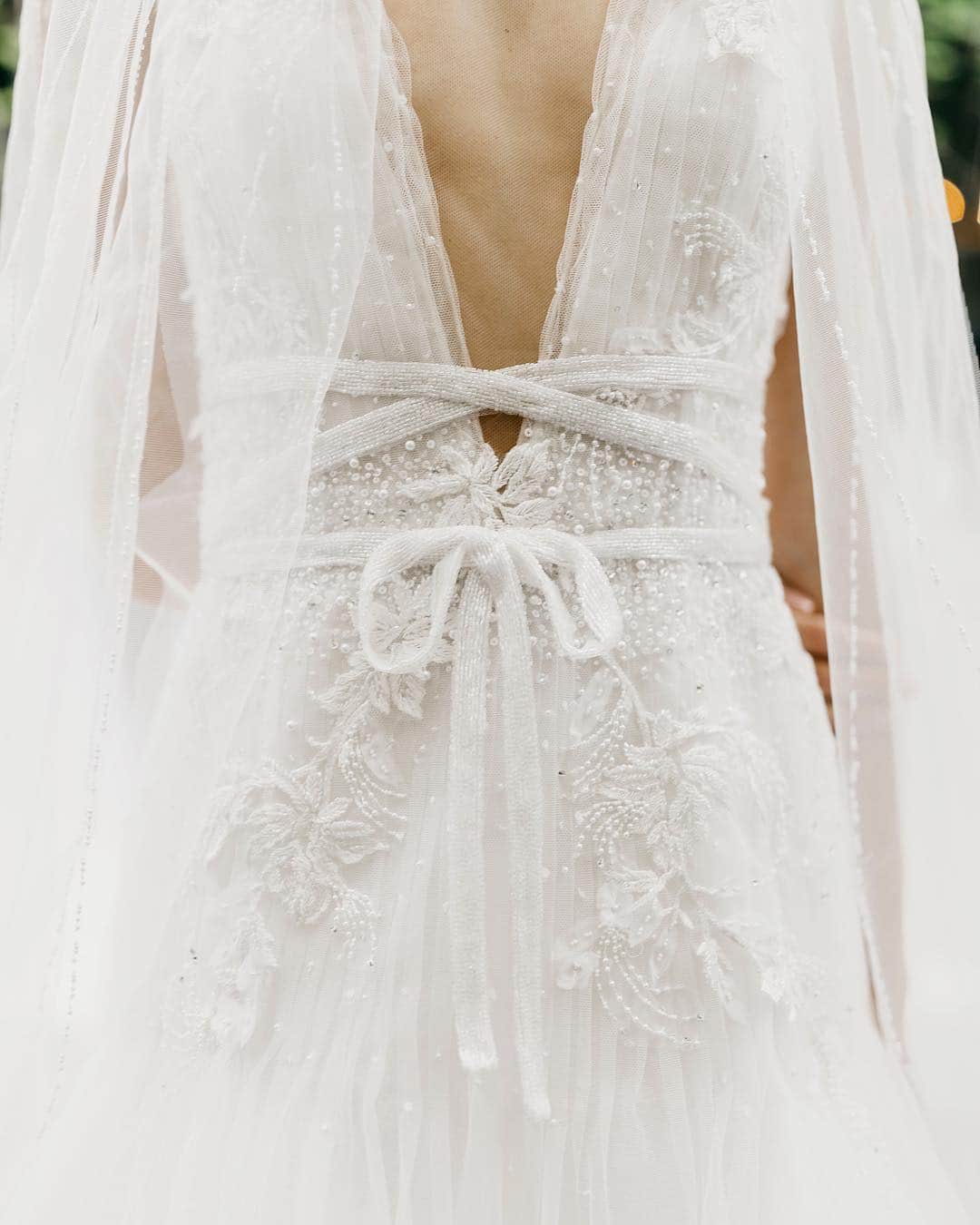 のインスタグラム：「The delicate ‘Elizabeth’ gown from the Fall/Winter 2019 Marchesa bridal collection features plunging v-neckline pleated tulle, scattered crystal and intricate sequin embroidery. Shot by @adriana.r.miranda. #marchesa #marchesabridal」