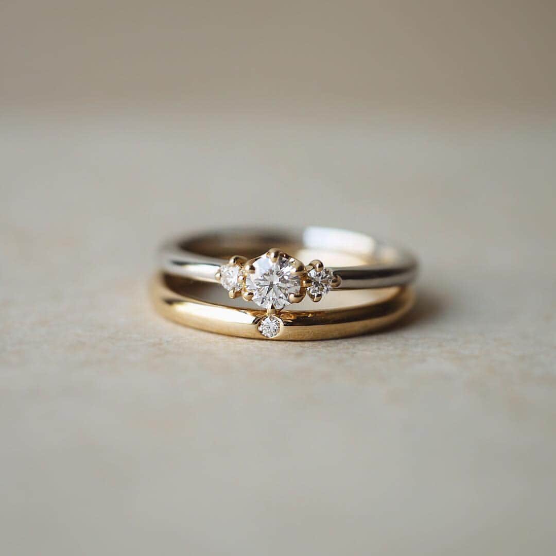 JKプラネット銀座.表参道.福岡|結婚指輪セレクトショップさんのインスタグラム写真 - (JKプラネット銀座.表参道.福岡|結婚指輪セレクトショップInstagram)「💍 @yukahojo_jewelry 優しい佇まいの婚約指輪Storyと、結婚指輪Soulmatesの重ね付け♡ ふっくらとしたかたちが、眺めているだけで幸せな気持ちにさせてくれます😊 ・ 左手の薬指の上で、おふたりの素敵なストーリーが積み重なってゆきますように💛 ・ Very classic and chic engagement ring "Story " and weddingband " Soulmates" introduced in previous post.  Wishing you will find the reflection of your happy love stories on your ring finger😊💍 ・ ・ 【YUKA HOJO ユカホウジョウ】 銀座・表参道・横浜元町・福岡天神・熊本上通 の正規取扱店 JKPlanet（@jkplanet.jewelry ） ☎︎ 03-6280-6927〈JKPlanet銀座本店〉 ☎︎ 03-6447-4383〈JKPlanet表参道店〉 ☎︎ Coming Soon〈JKPlanet横浜元町店 4月5日NEW OPEN〉 ☎︎ 092-791-9402〈JKPlanet福岡天神店〉 ☎︎ 096-321-6460〈JKPlanet熊本上通店〉 ※5店ともご予約なしで自由にご覧頂けます♪ . #JKPlanet #JKプラネット #結婚指輪のセレクトショップ #婚約指輪のセレクトショップ  #銀座結婚指輪 #表参道結婚指輪 #横浜結婚指輪 #福岡結婚指輪 #熊本結婚指輪 #YUKAHOJO #ユカホウジョウ #婚約指輪 #エンゲージリング  #結婚指輪 #マリッジリング #エンゲージ #リング #ブライダルリング #ブライダルジュエリー #結婚指輪探し #結婚指輪選び #婚約指輪探し #指輪探し #プロポーズ #婚約 #ブライダルリング #プレ花嫁 #日本中のプレ花嫁さんと繋がりたい #weddingring #engagementring #jewelry」3月27日 17時02分 - jkplanet.jewelry